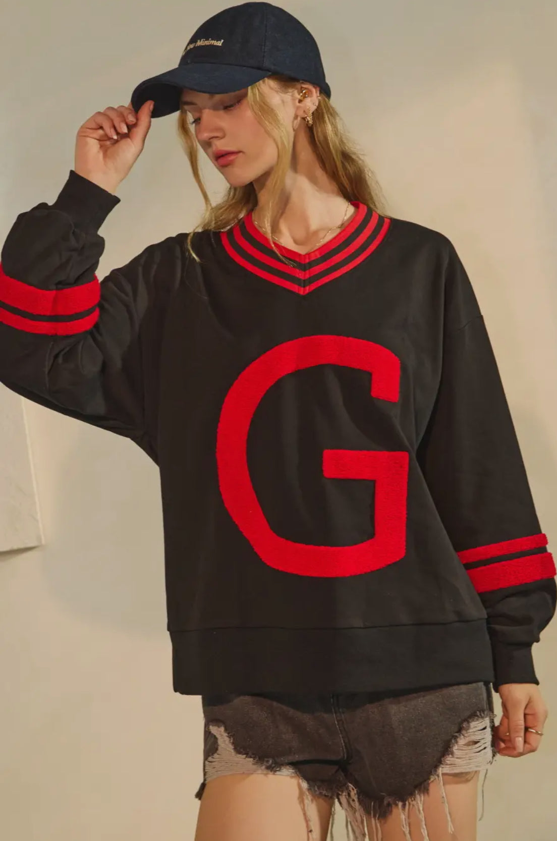 Black pullover with Giant red fuzzy G