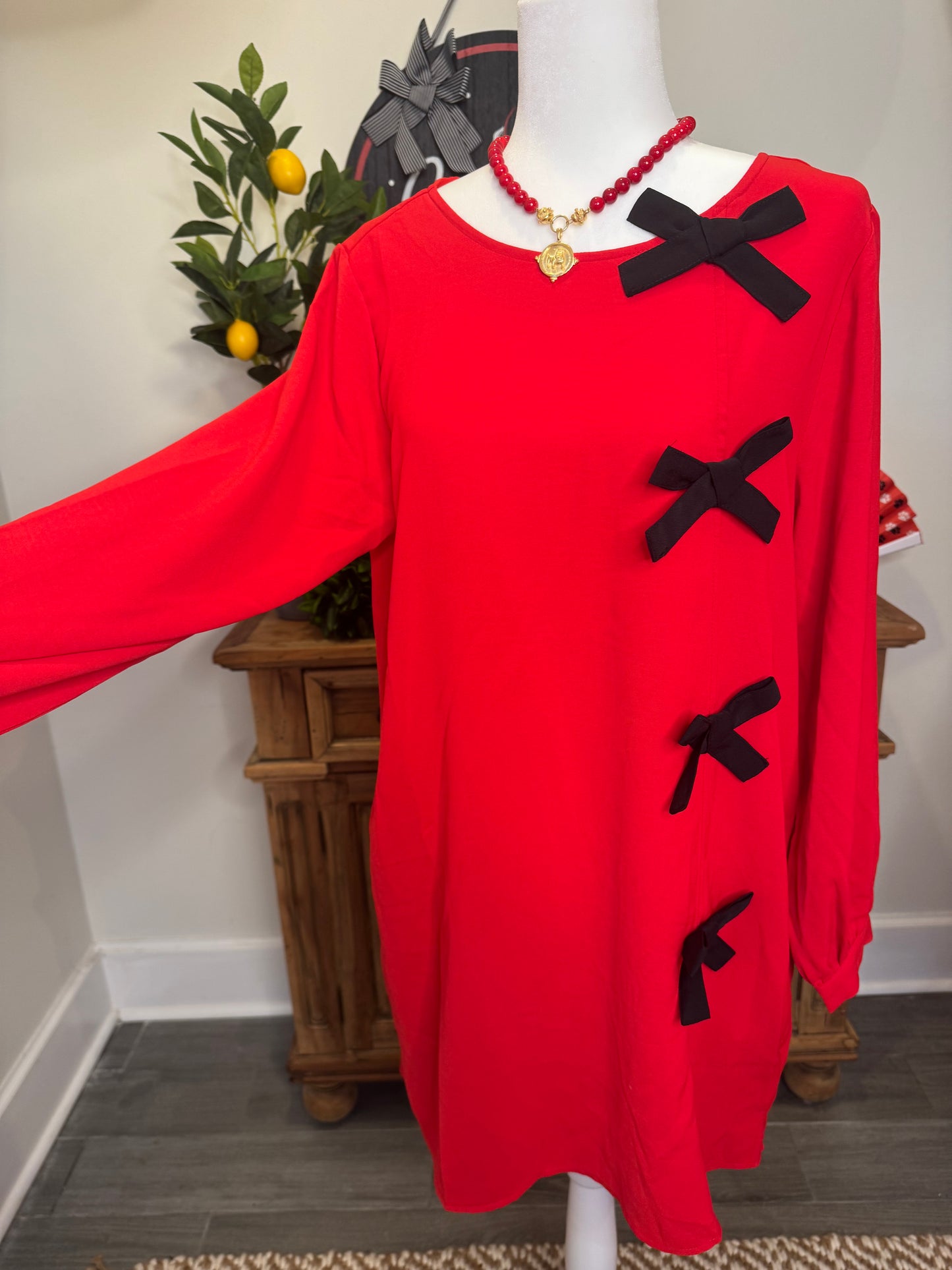 Red dress black bows marked down