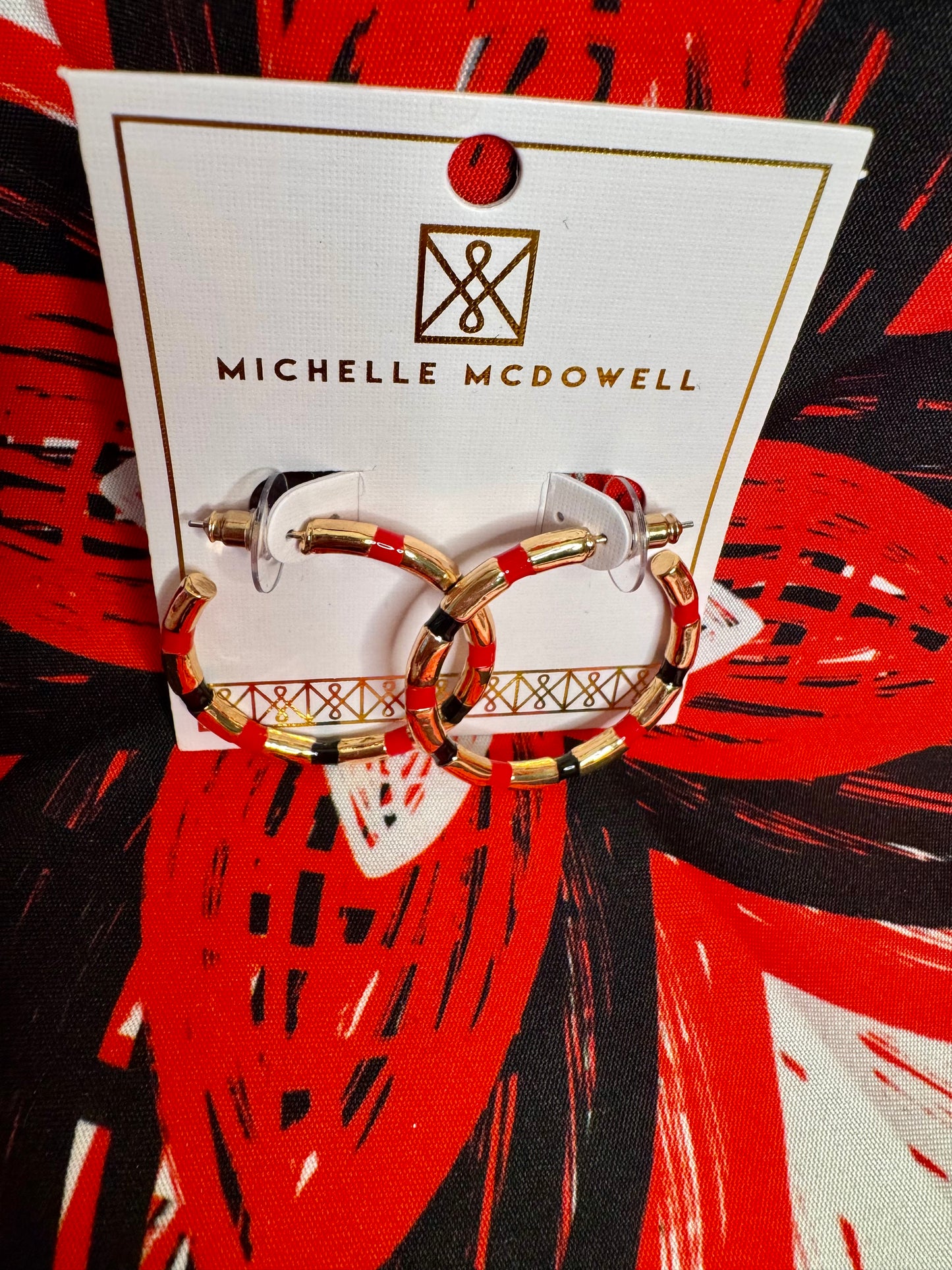 Gold, black and red hoops metal