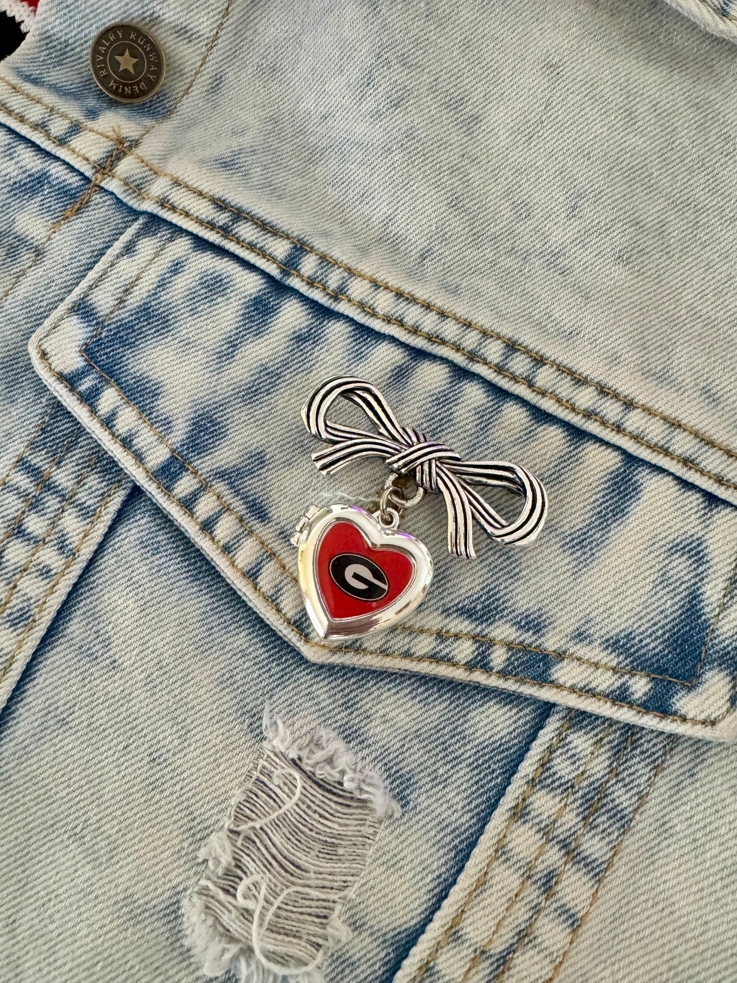 Brooch with bow and Georgia locket