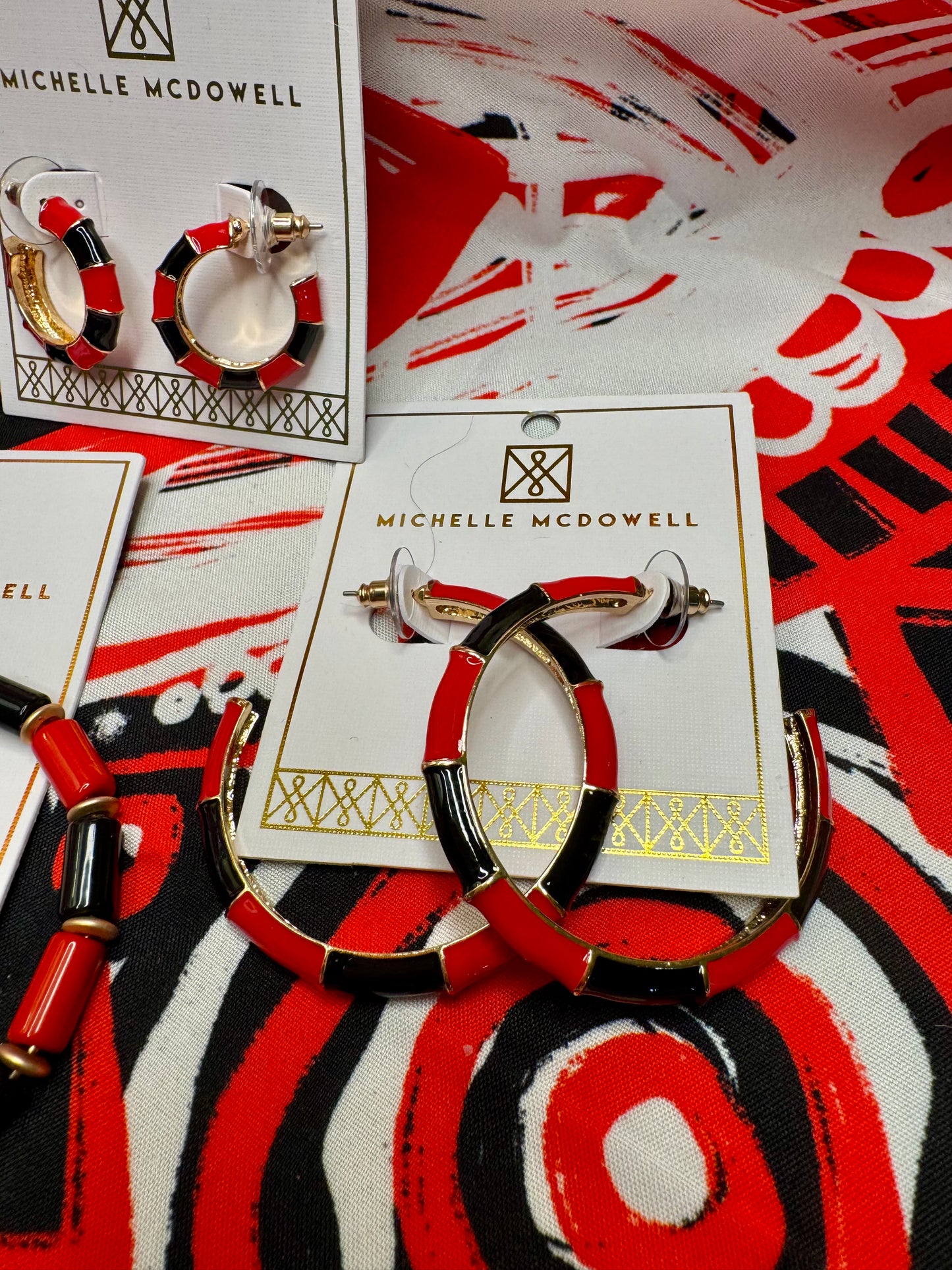 Med size gold metal black and red hoops