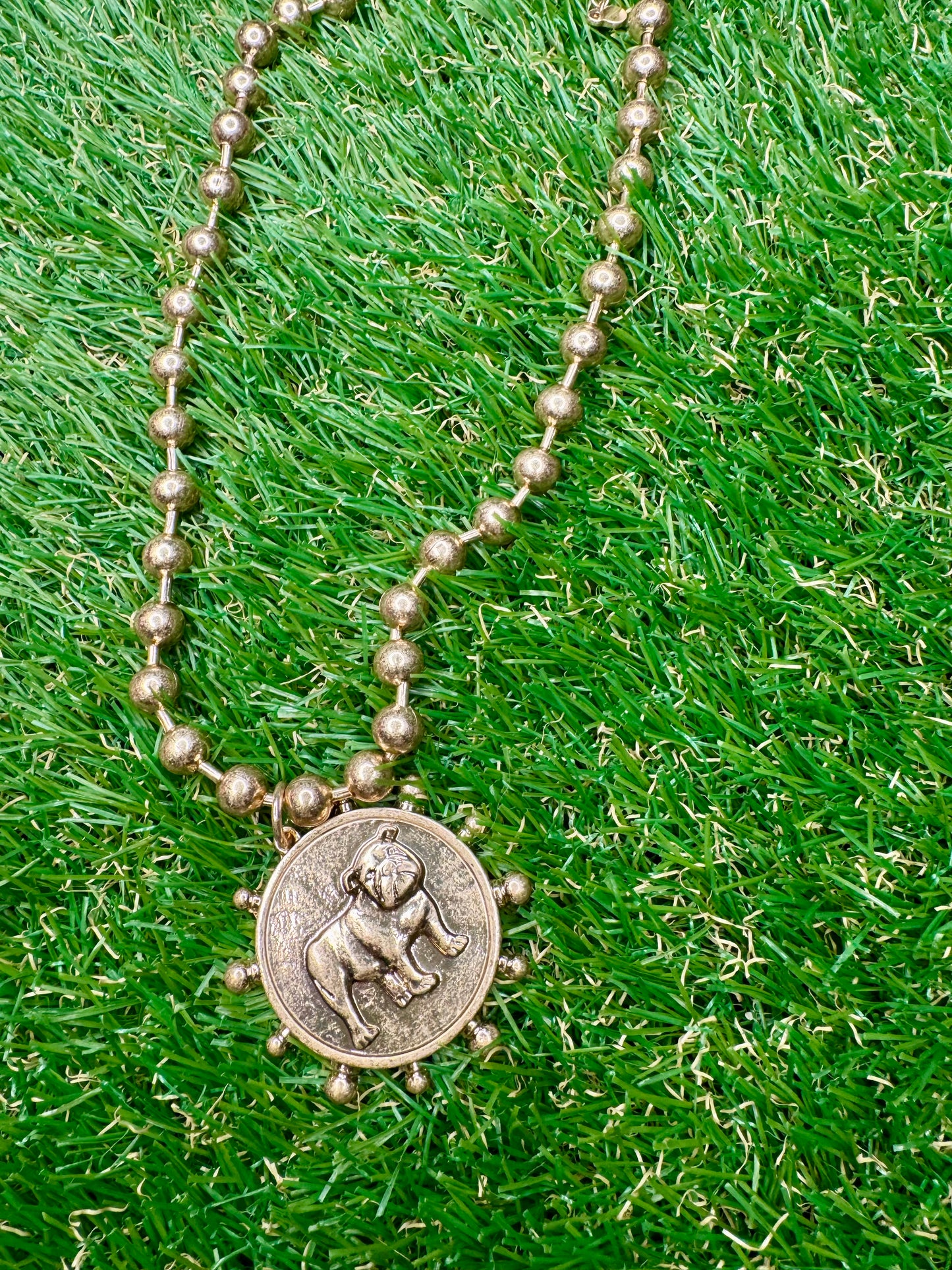 Metal gold necklace with dog medallion