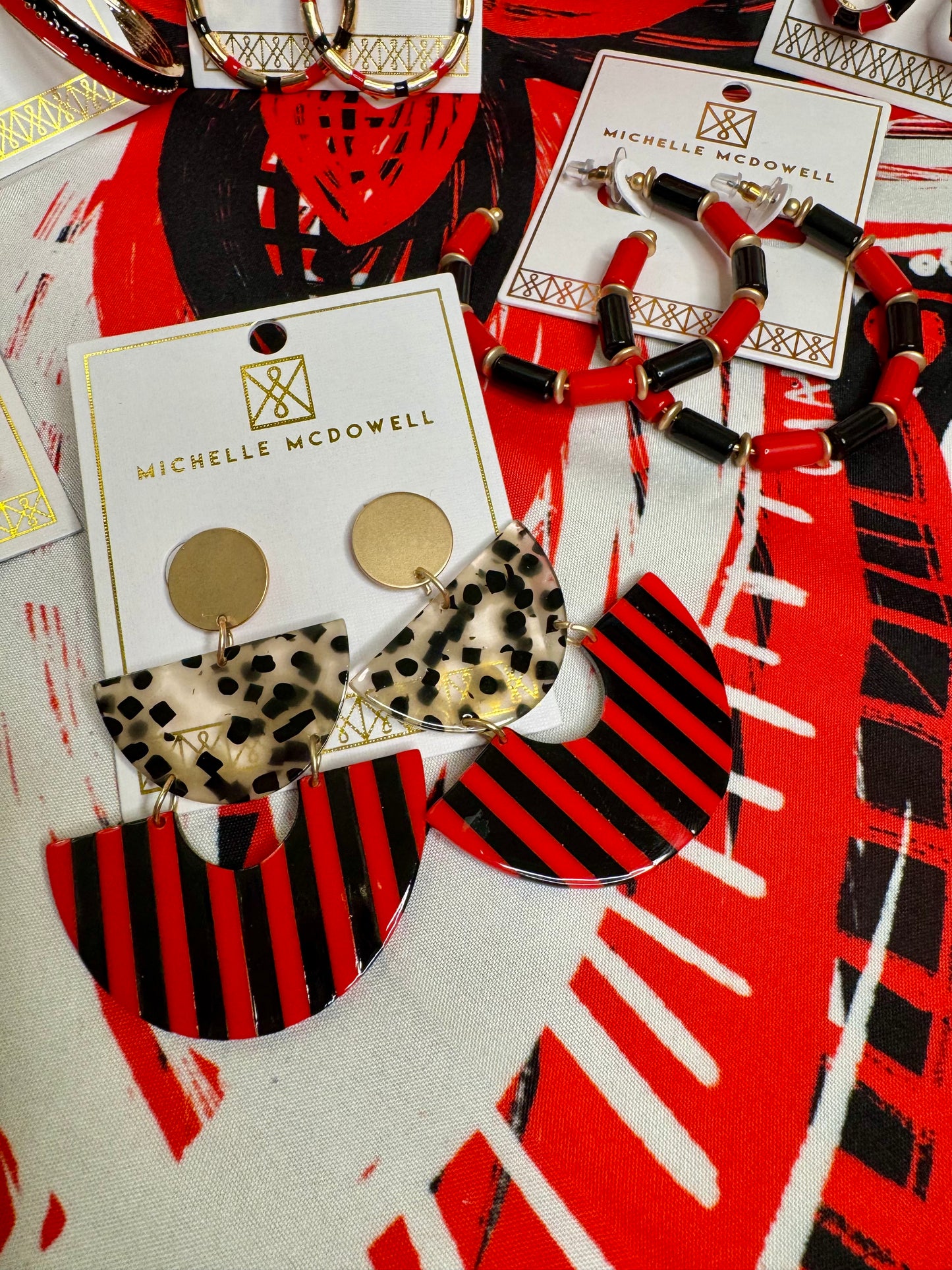 Acrylic red and black and gold dangle geo earrings