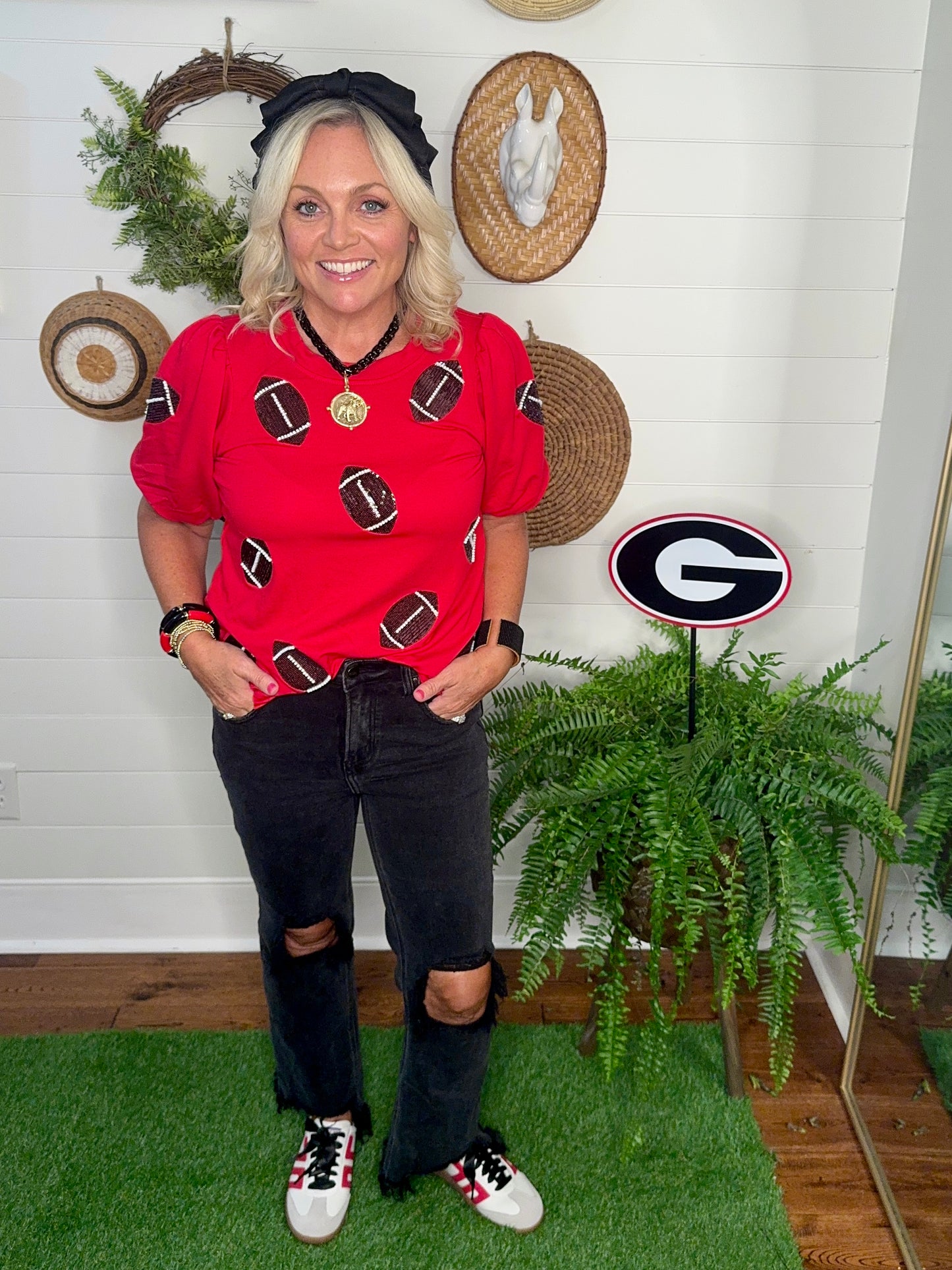 New red boutique top with sparkle footballs and bubble sleeves