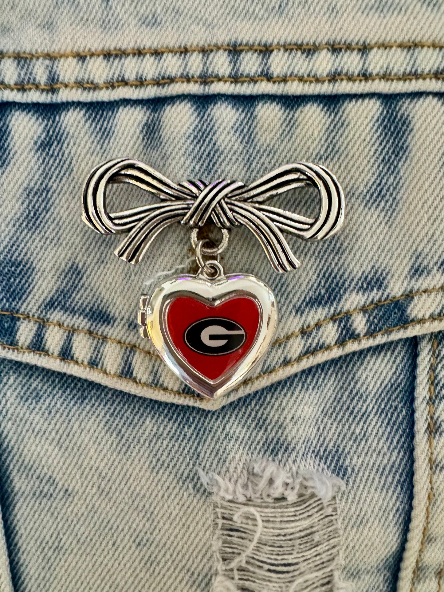 Brooch with bow and Georgia locket