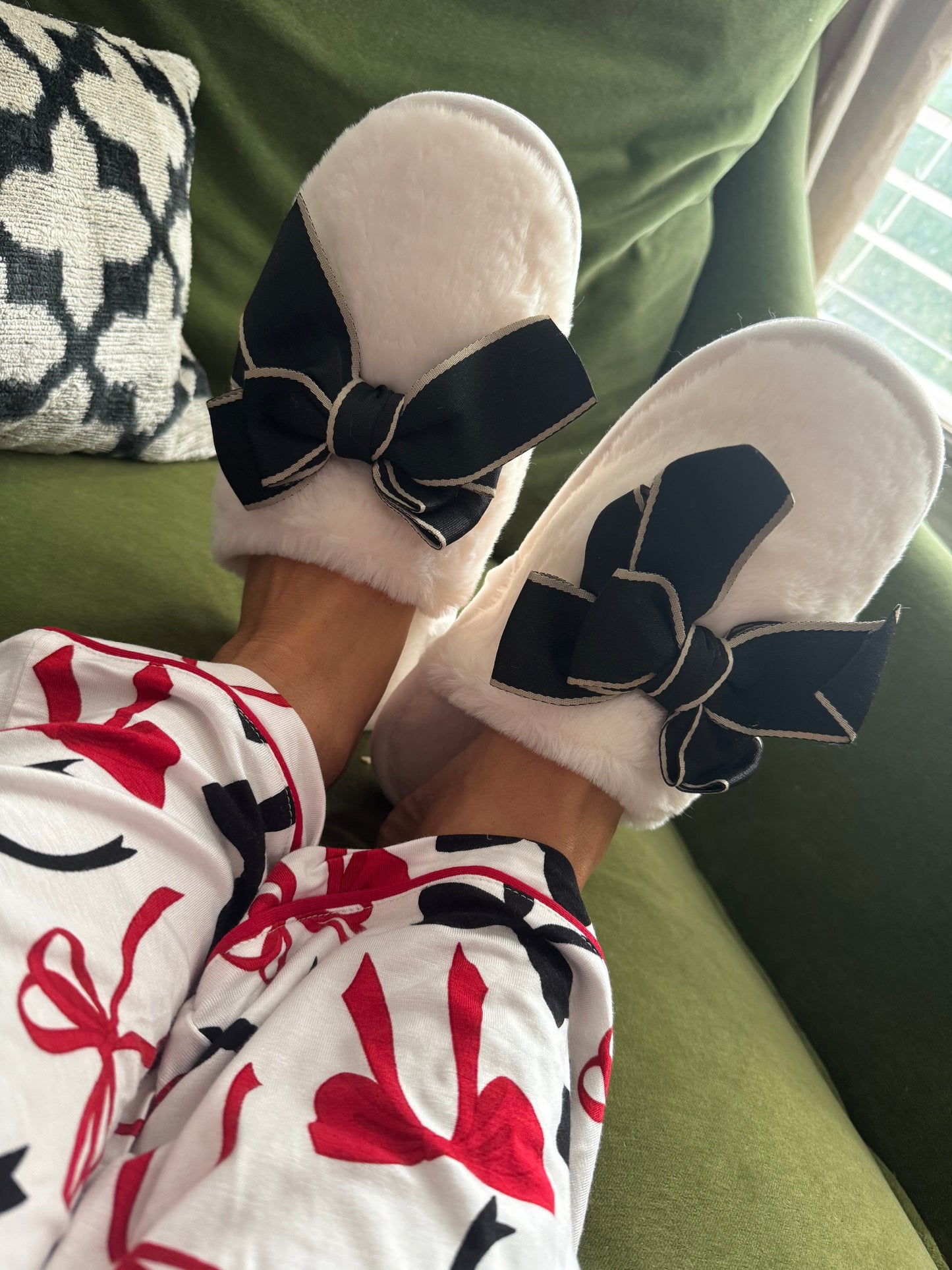 Cozy cream slippers black bow goes great with pajamas!