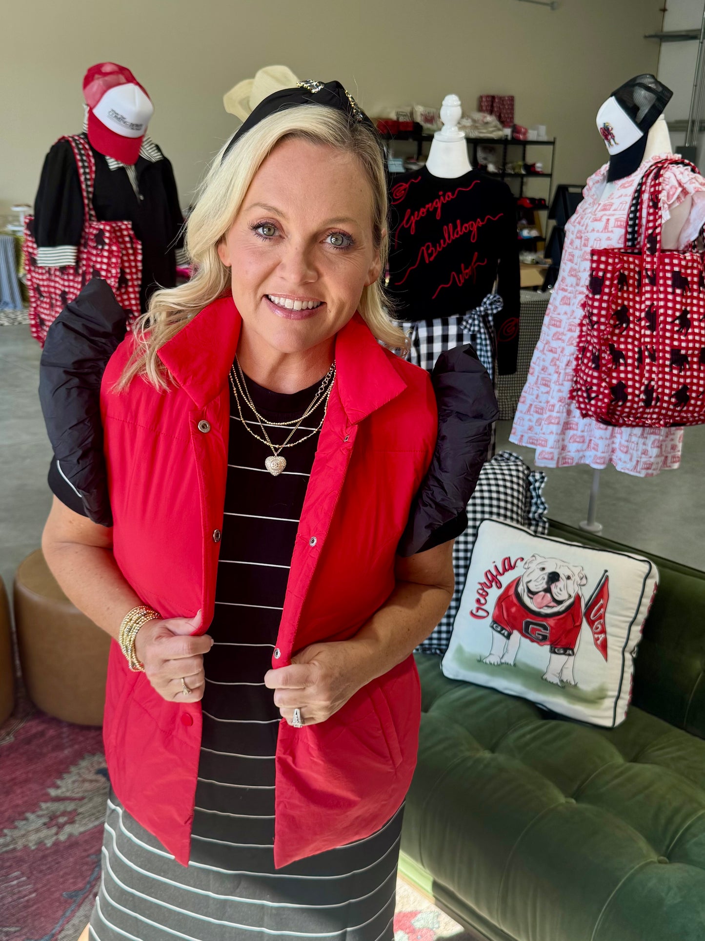 red puffer vest with black ruffle sleeves
