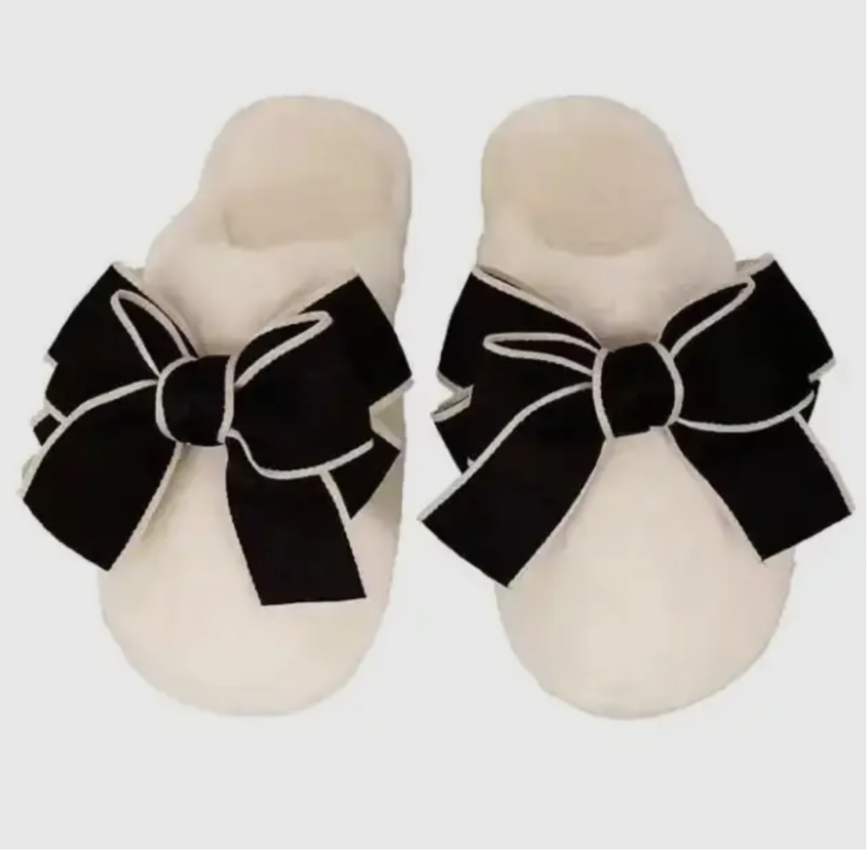 Cozy cream slippers black bow goes great with pajamas!