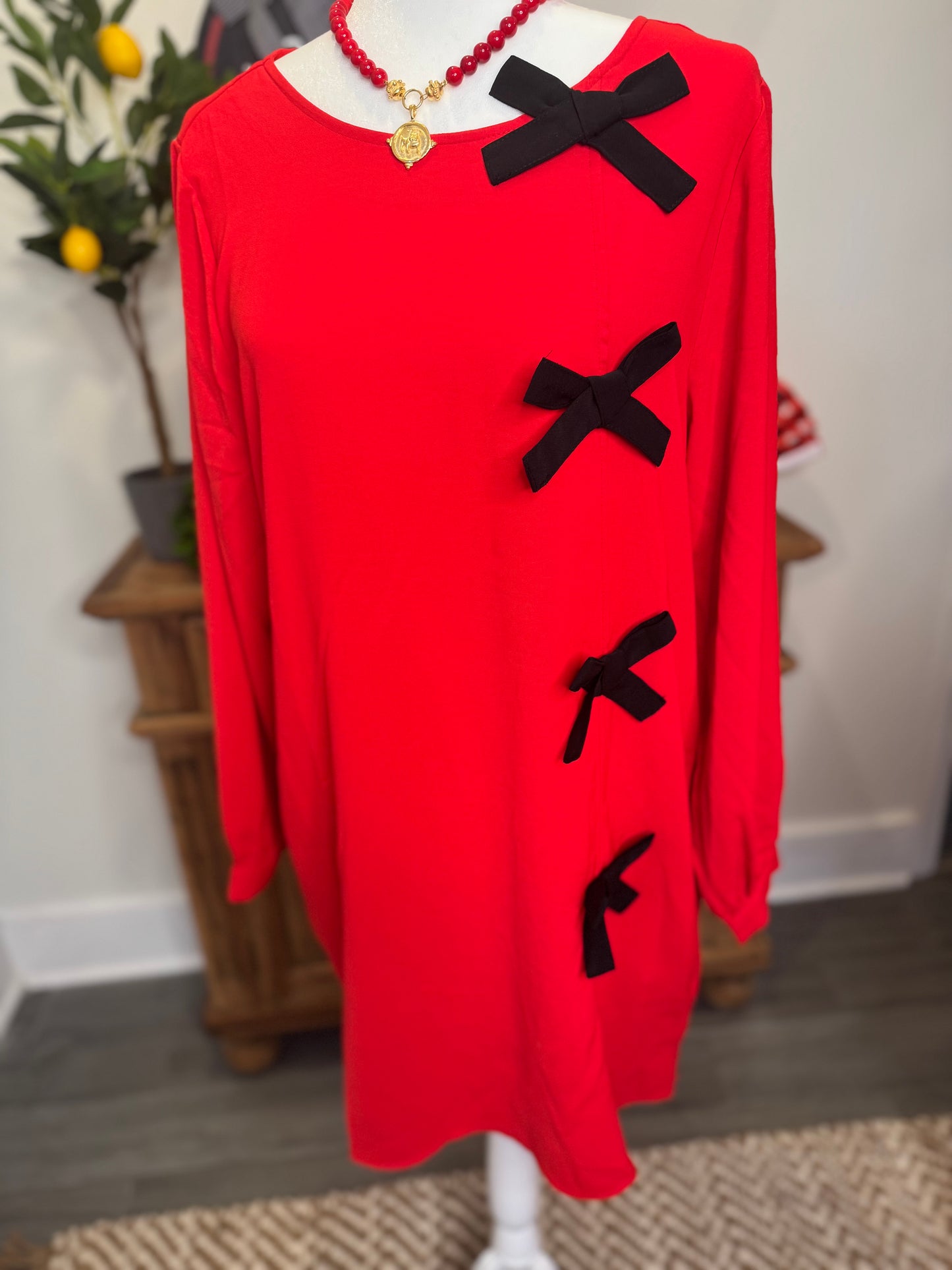 Red dress black bows marked down