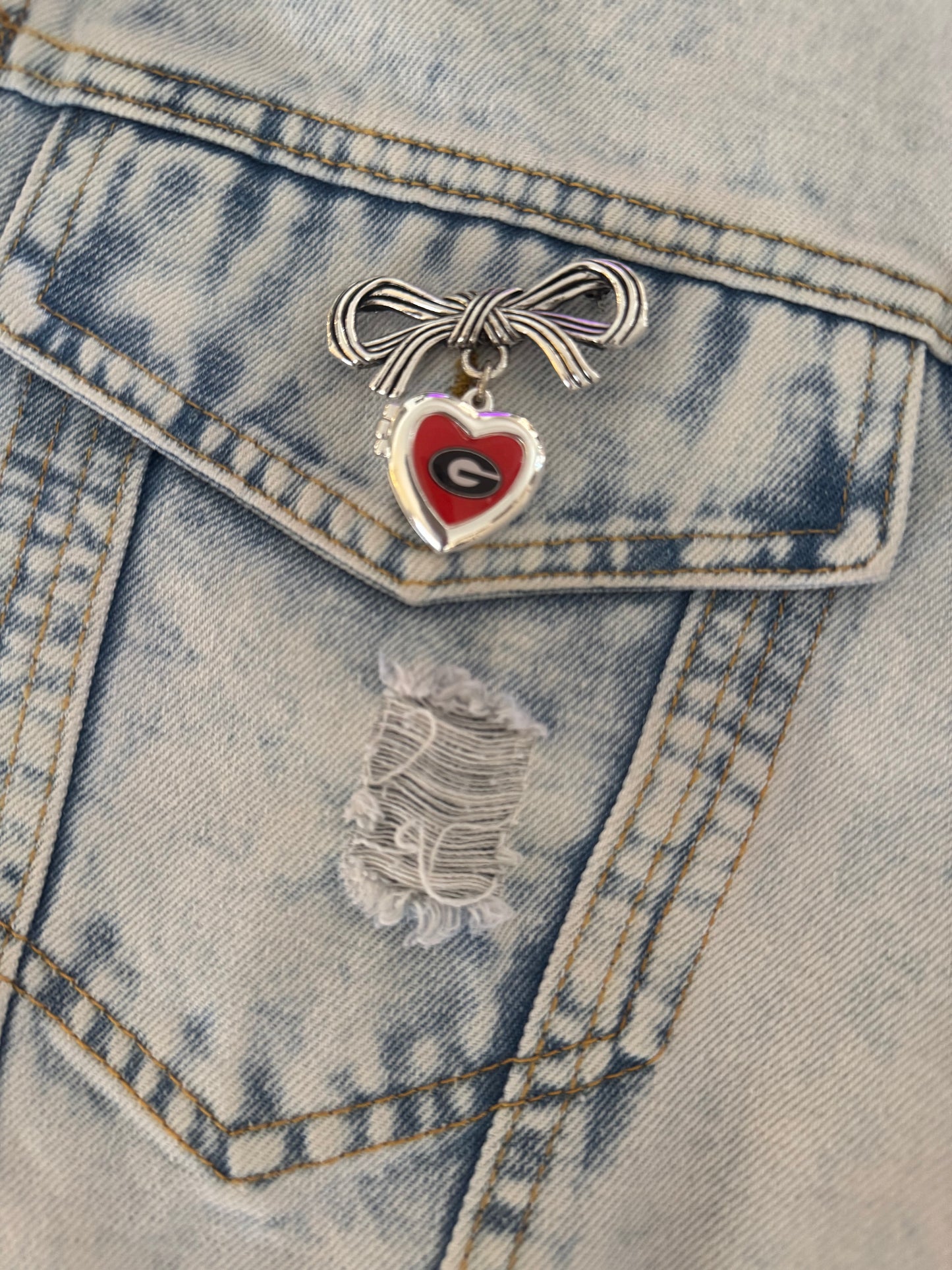 Brooch with bow and Georgia locket