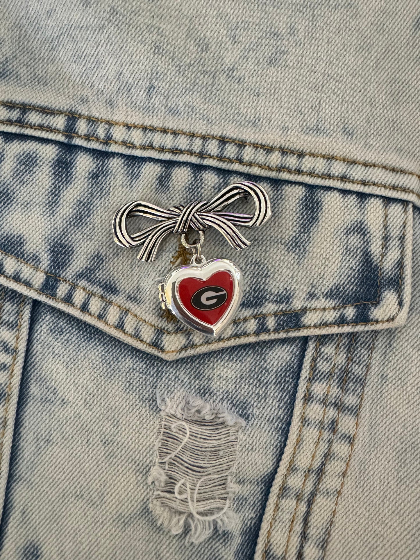 Brooch with bow and Georgia locket