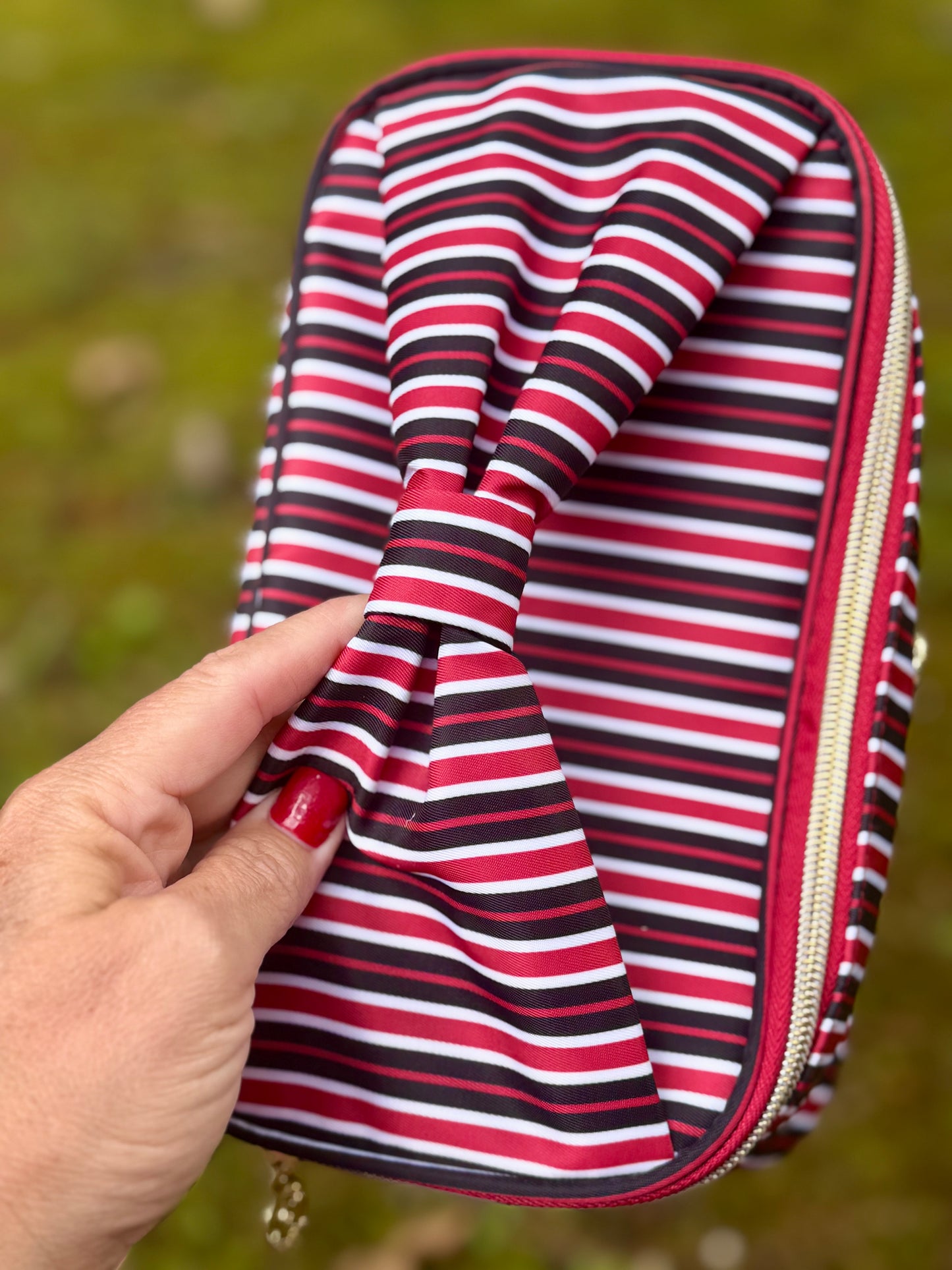 Red and black stripe cosmetic bag with bow handle!