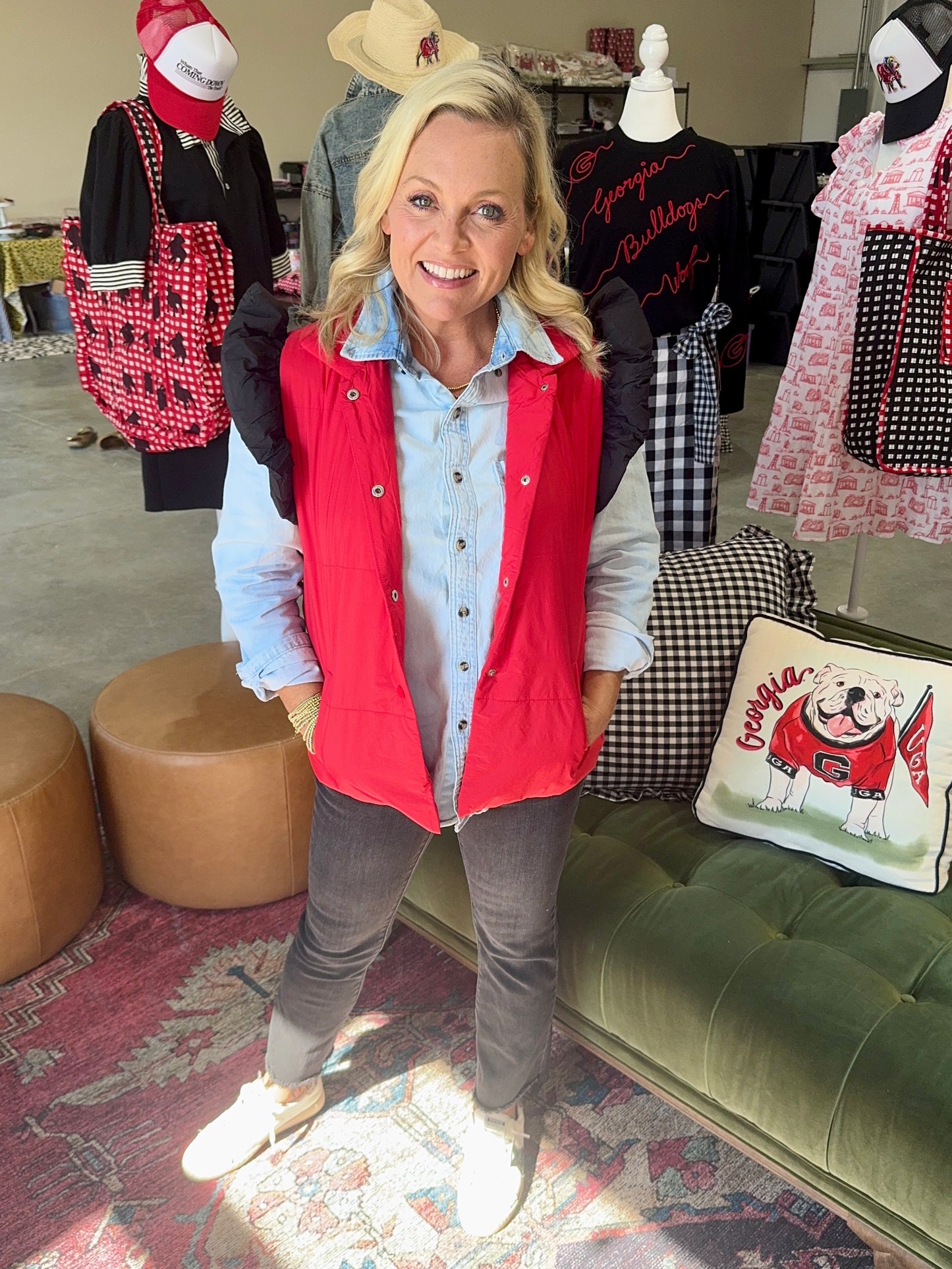 red puffer vest with black ruffle sleeves