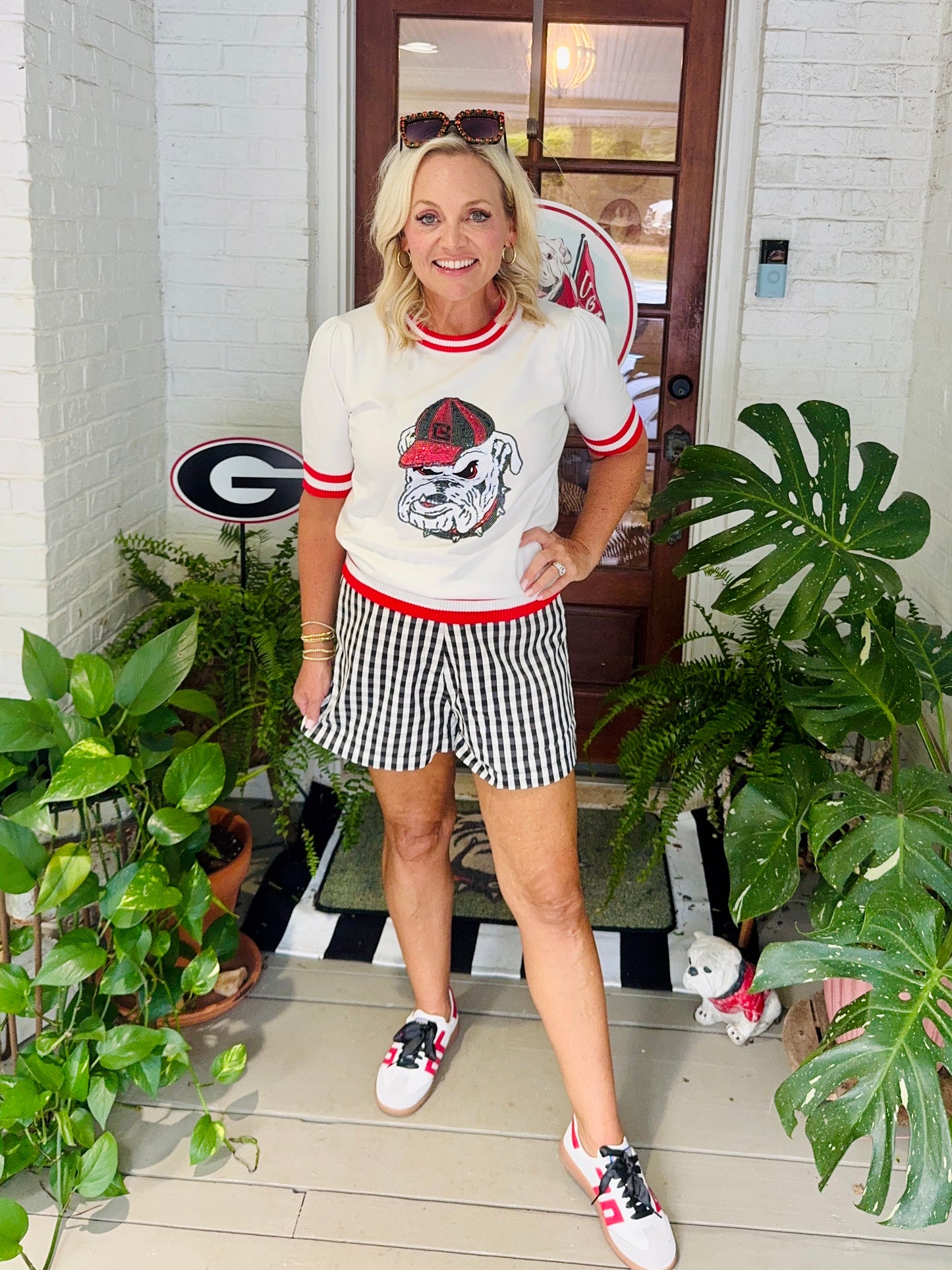 Varsity light weight knit sweater with stripe neckline sequin bulldog