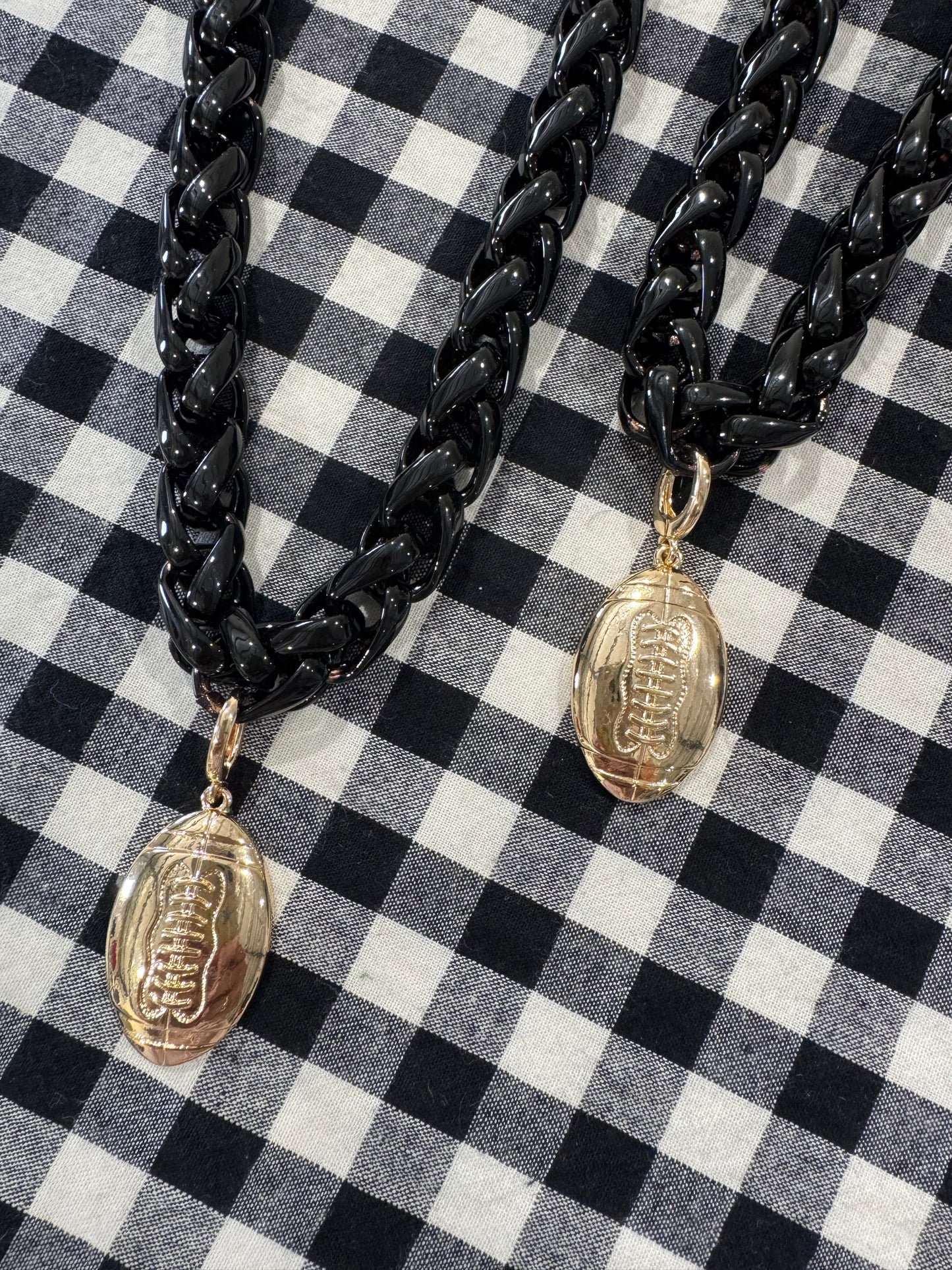 Black chain necklace with gold football charm