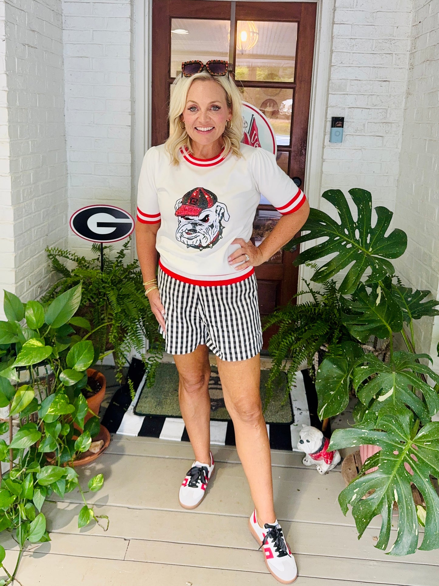 Varsity light weight knit sweater with stripe neckline sequin bulldog