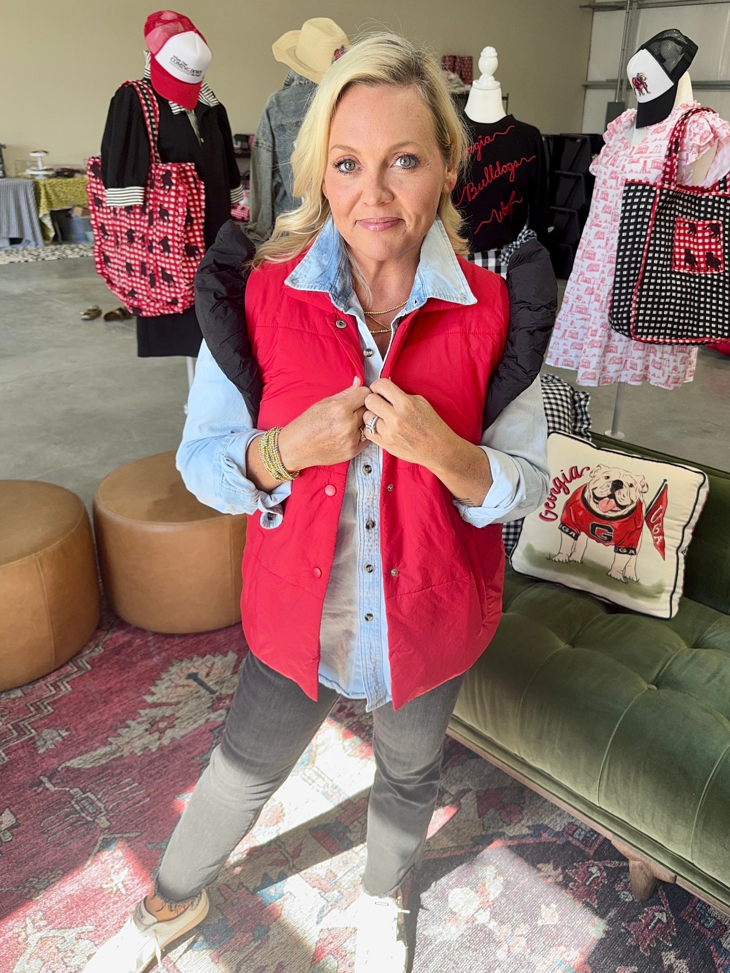 red puffer vest with black ruffle sleeves