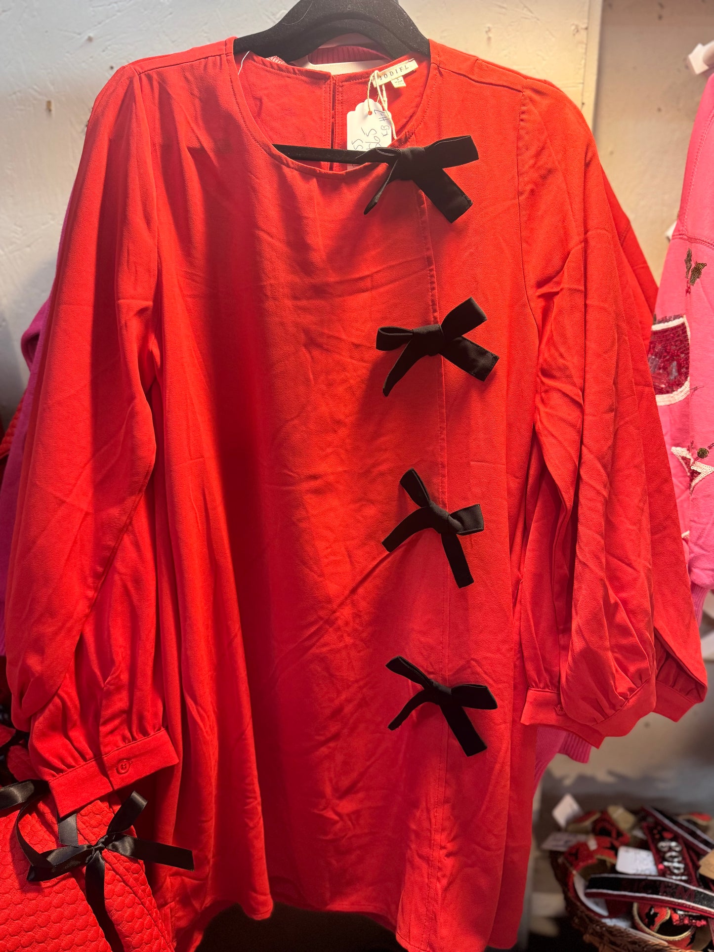 Red dress black bows marked down