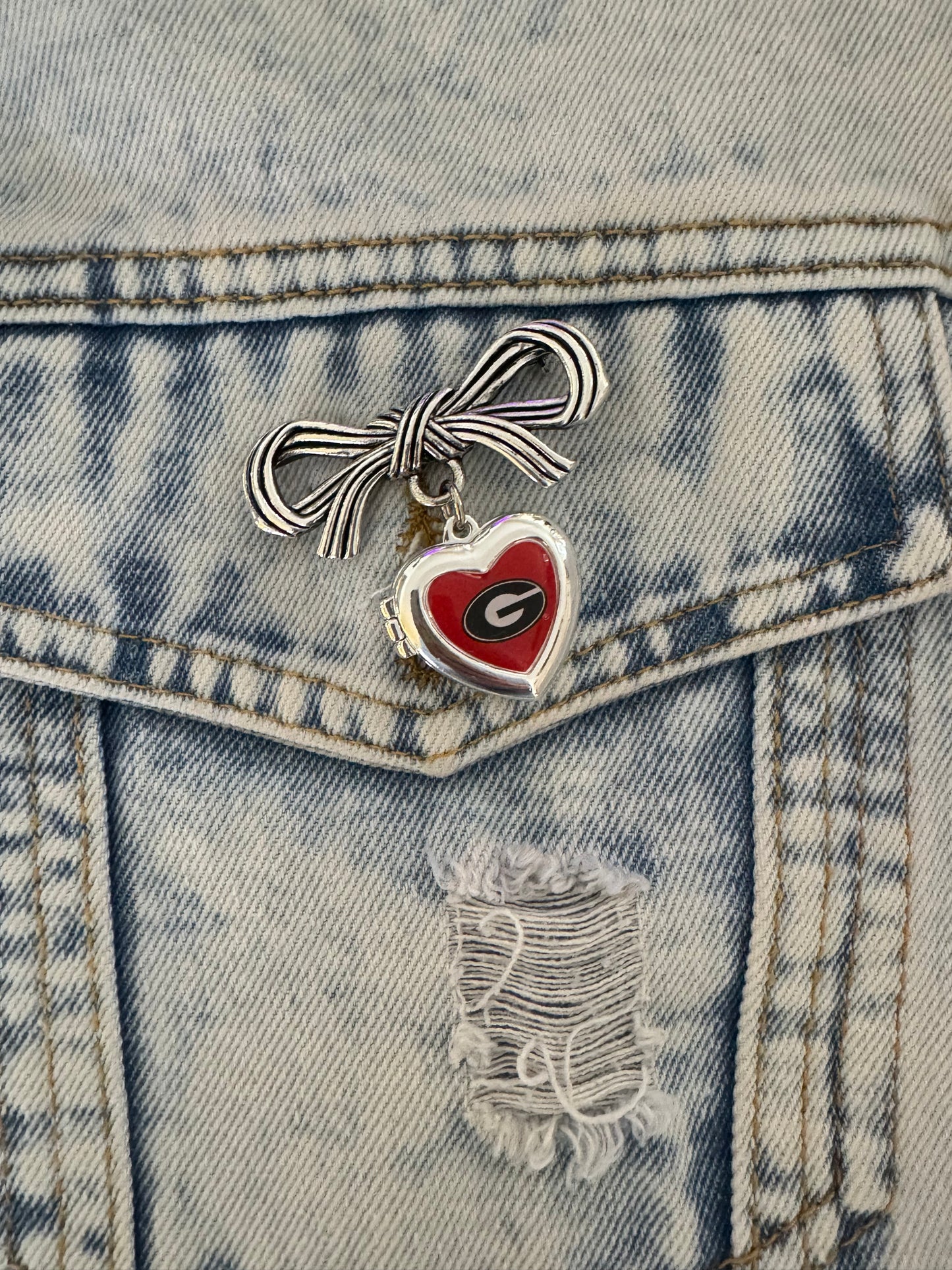 Brooch with bow and Georgia locket