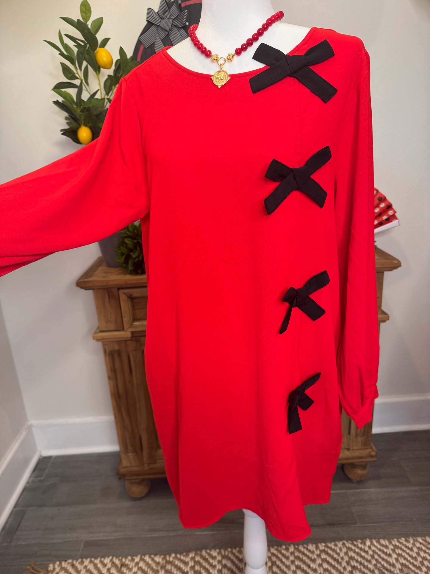 Red dress black bows marked down