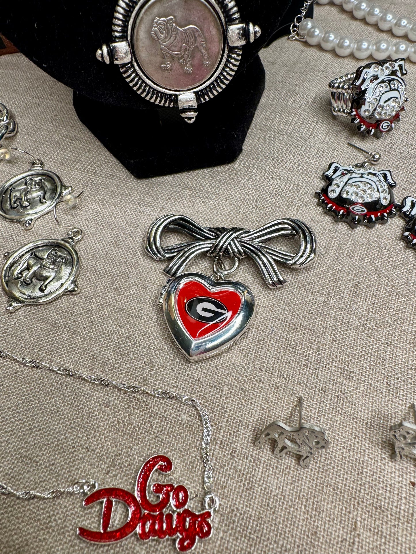 Brooch with bow and Georgia locket