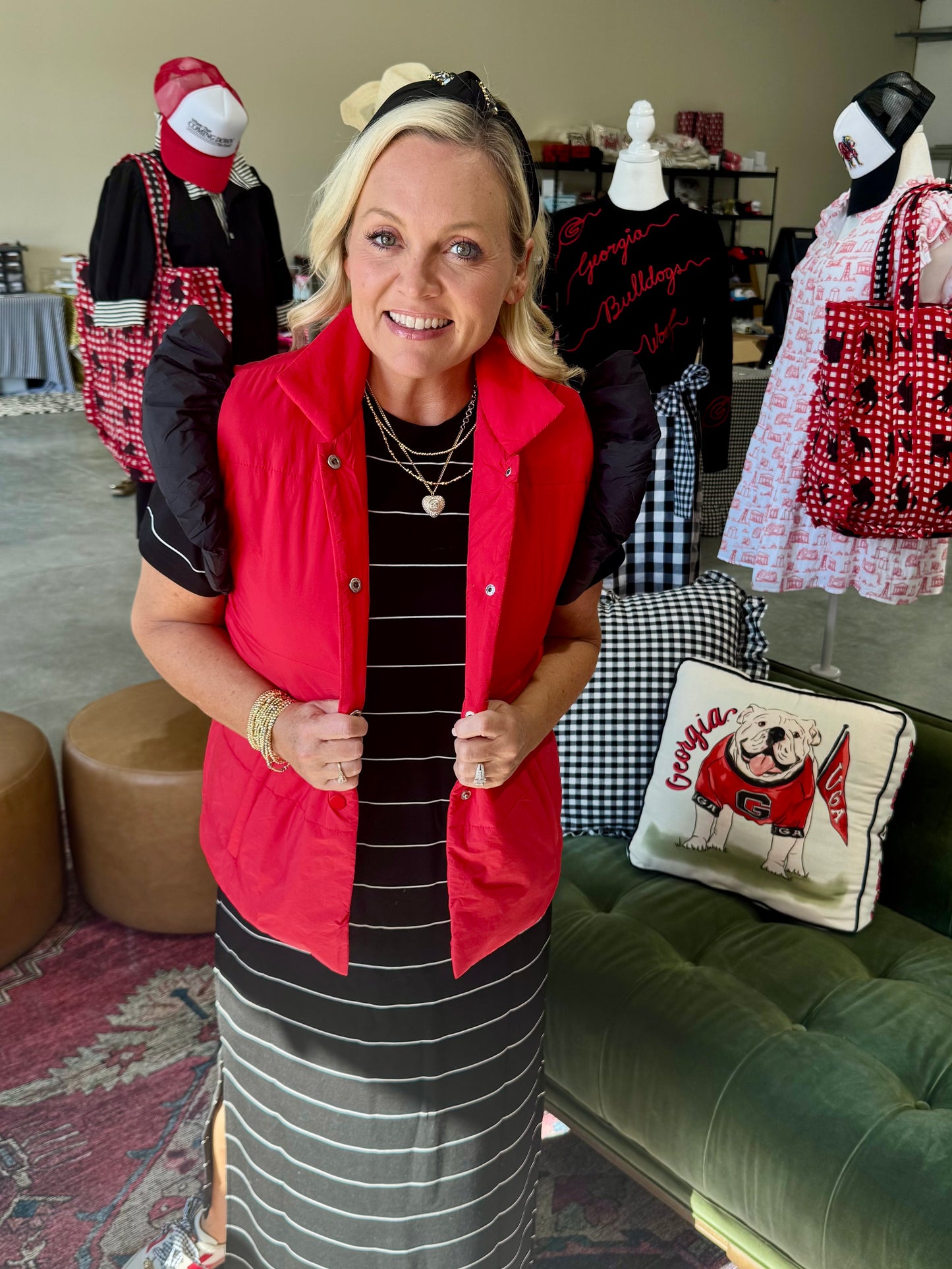 red puffer vest with black ruffle sleeves