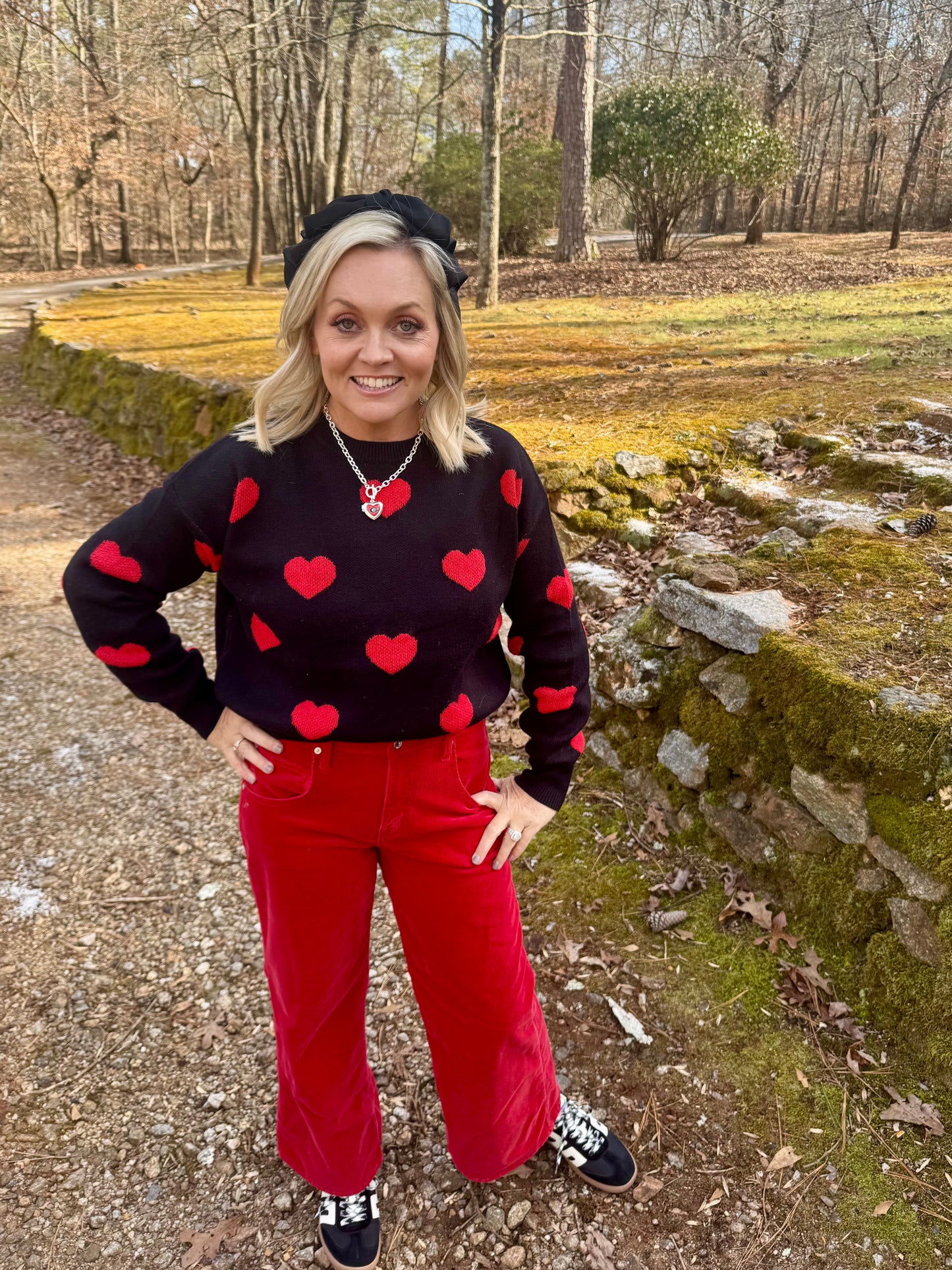 Black sweater red hearts Valentine’s Day marked down