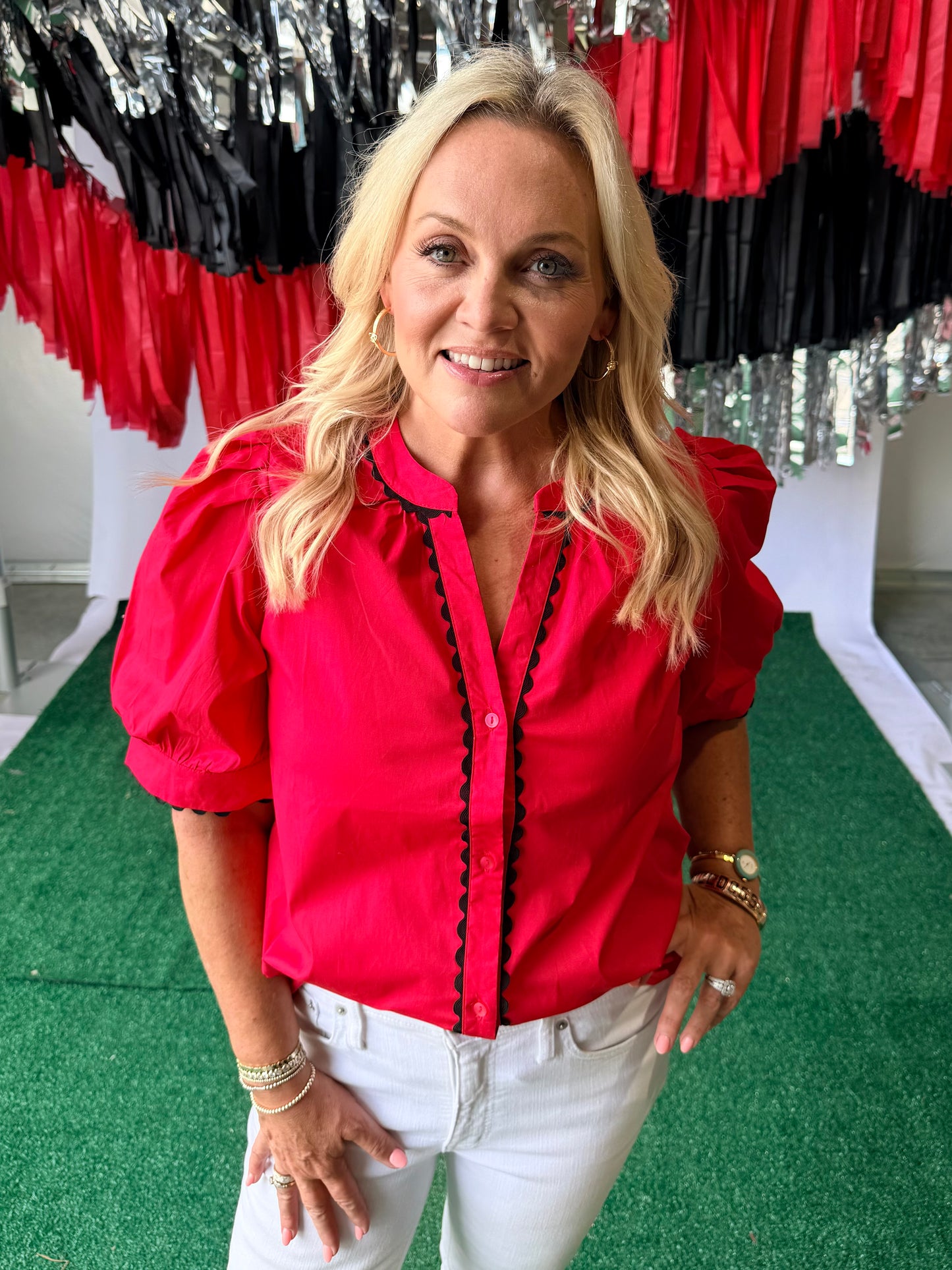 Red blouse with black pipping