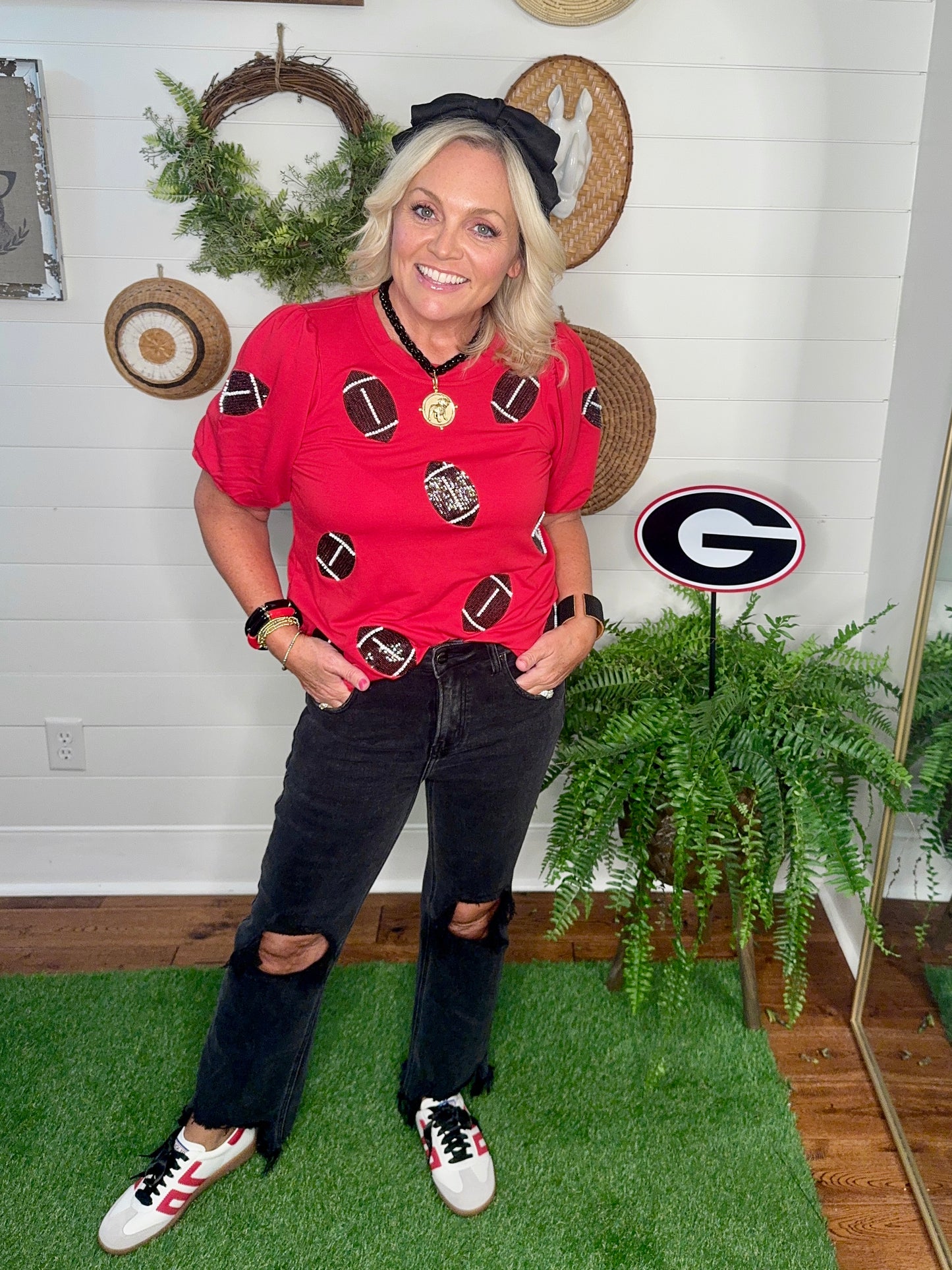 New red boutique top with sparkle footballs and bubble sleeves