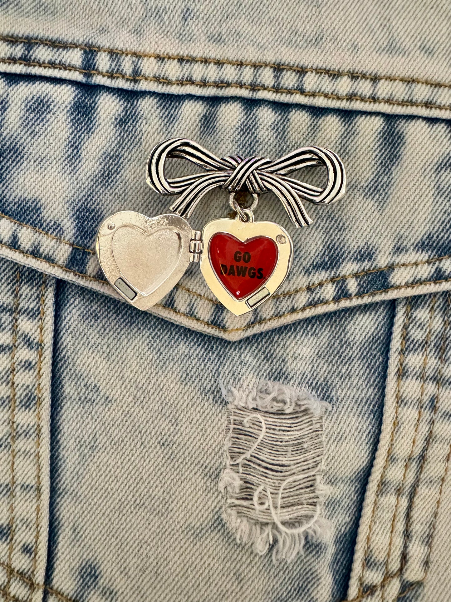 Brooch with bow and Georgia locket