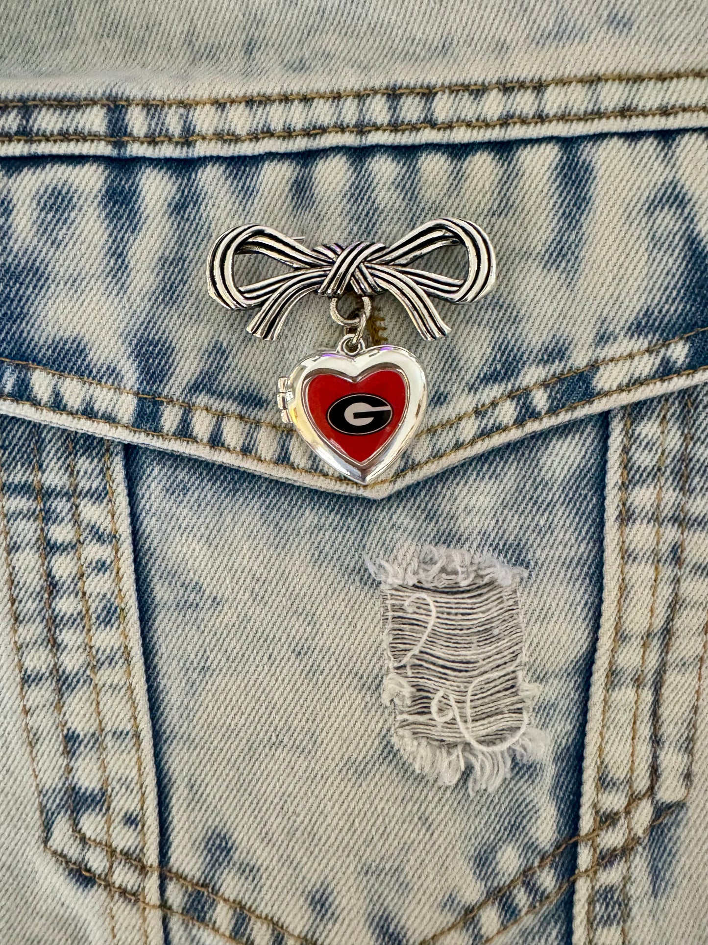 Brooch with bow and Georgia locket