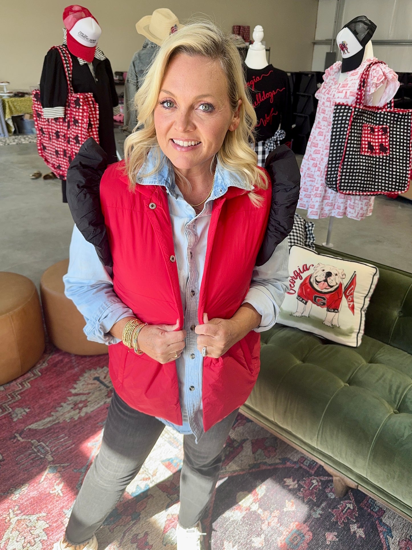 red puffer vest with black ruffle sleeves