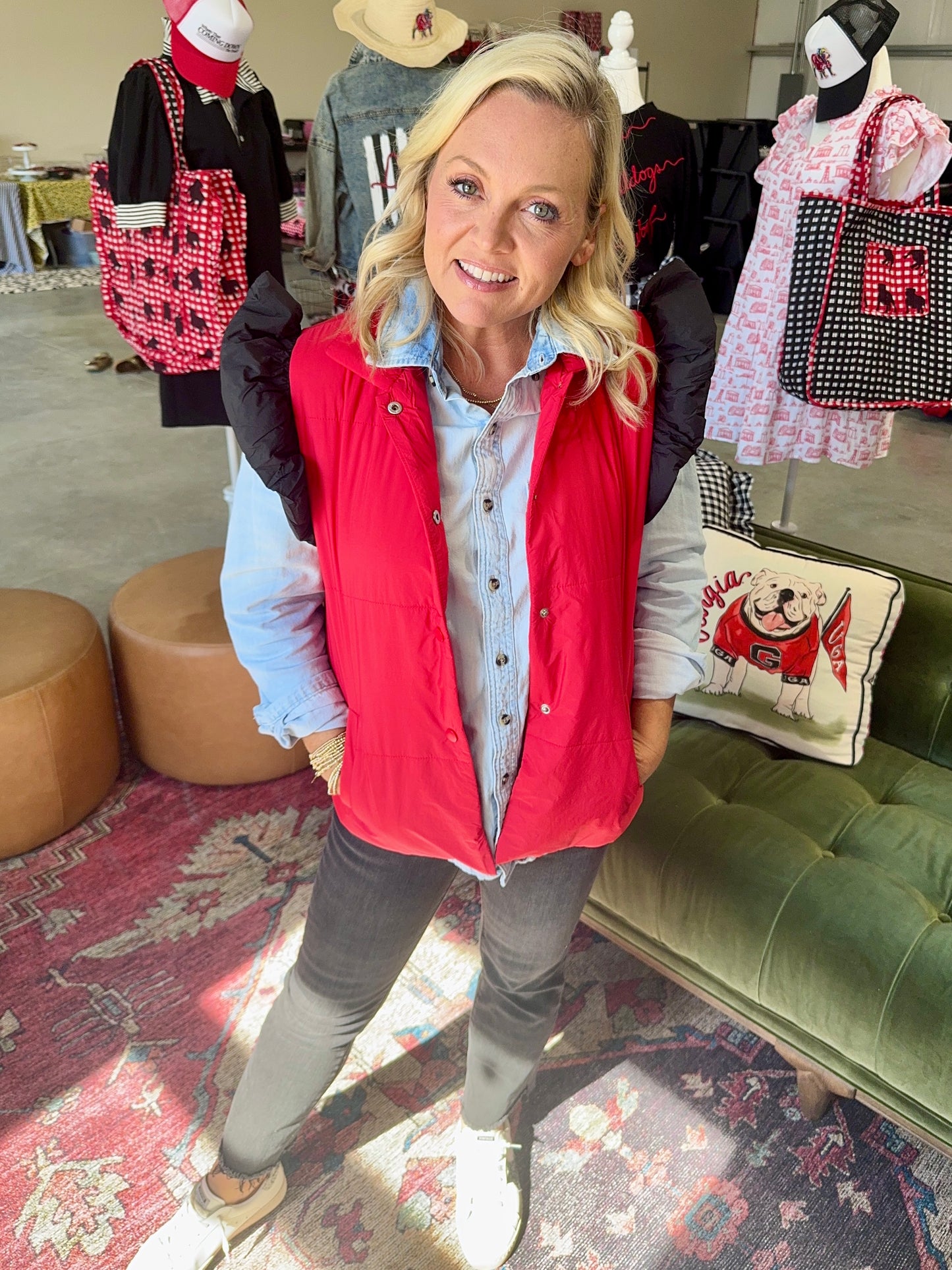 red puffer vest with black ruffle sleeves
