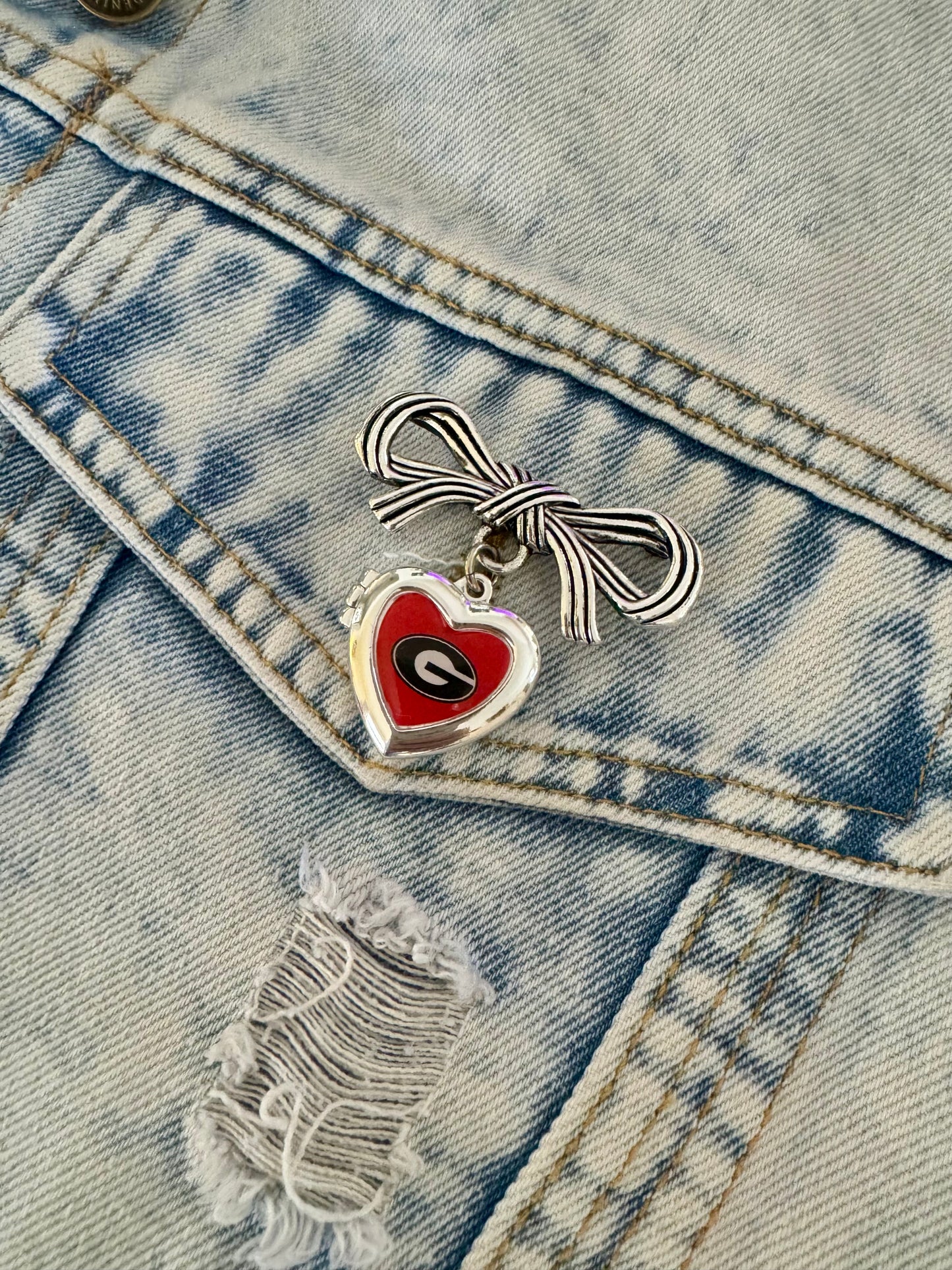 Brooch with bow and Georgia locket