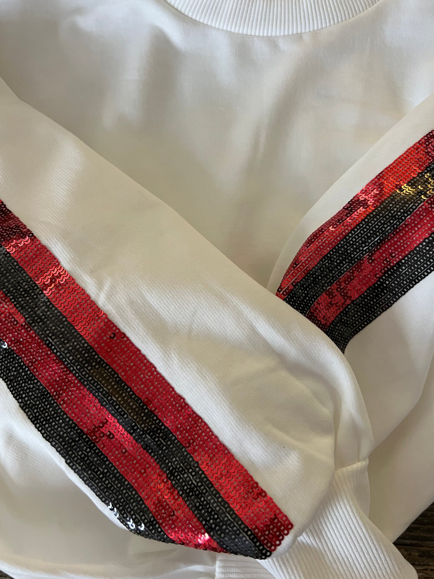 Boutique luxury white sweatshirt red and black sequin sleeves new lower price
