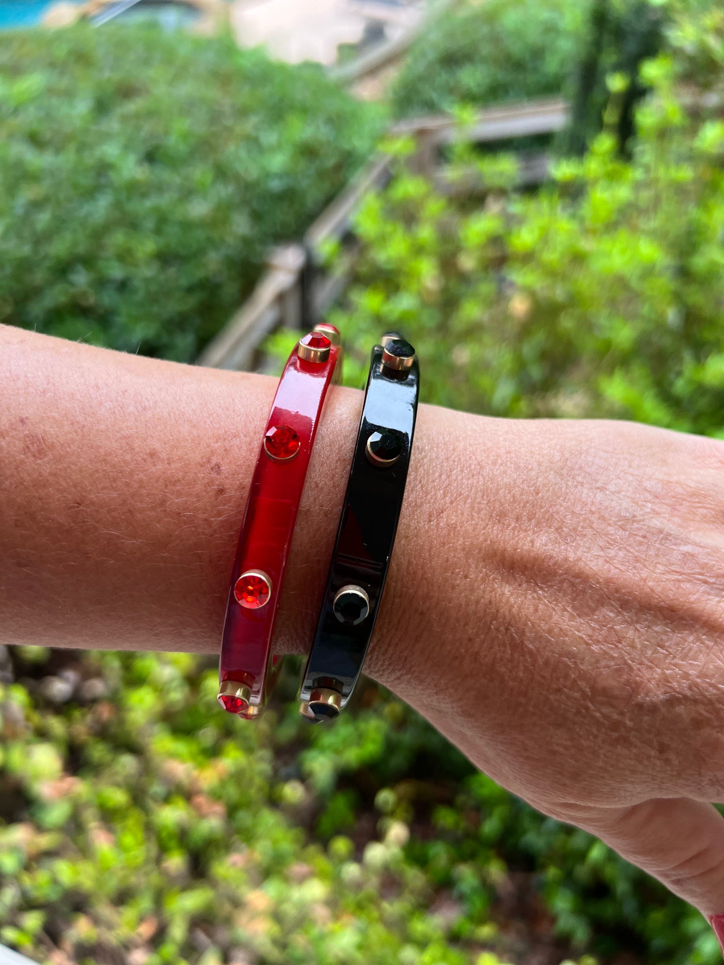 Red resin bracelet with rhinestone studs