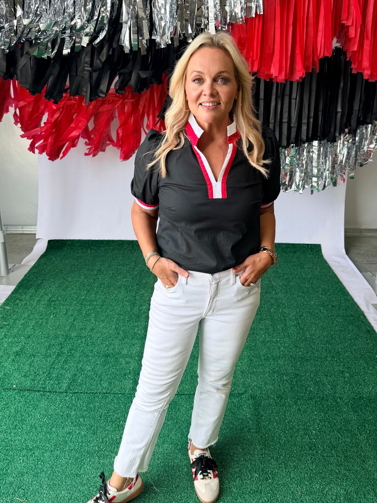 Black blouse with red and white trim