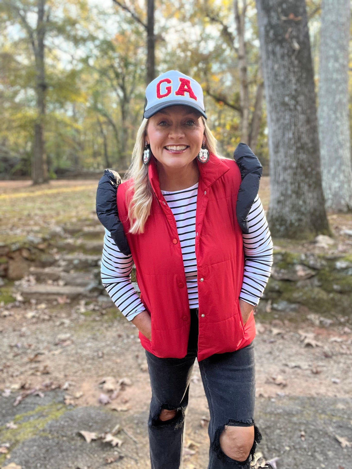 red puffer vest with black ruffle sleeves