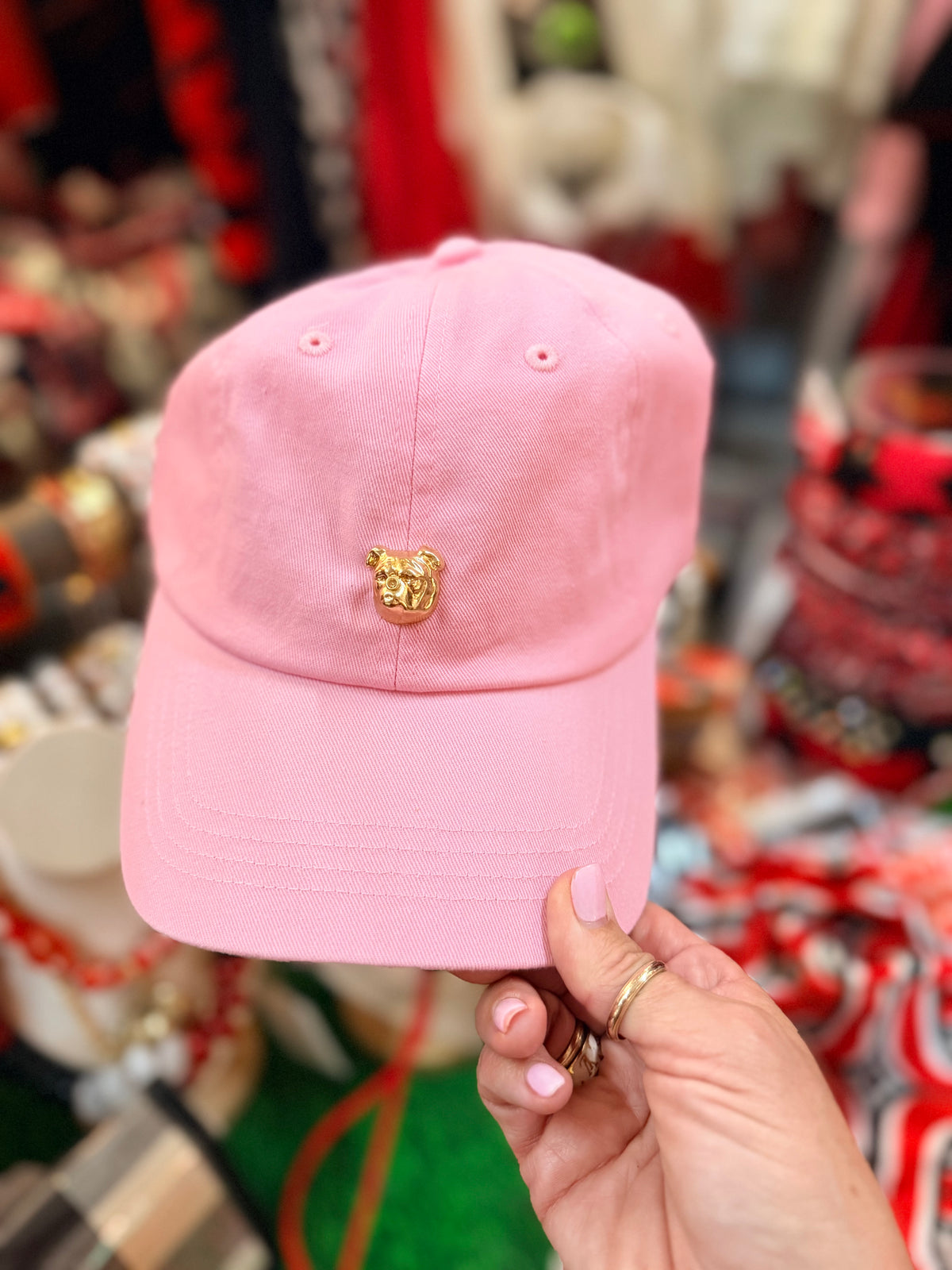 Pink hat with gold bulldog