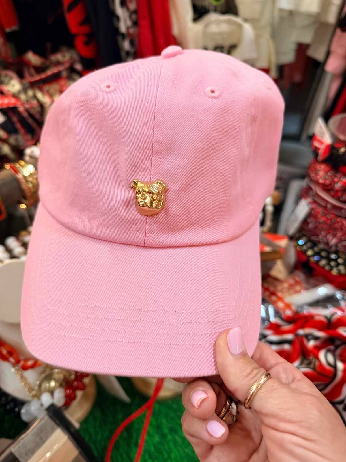 Pink hat with gold bulldog