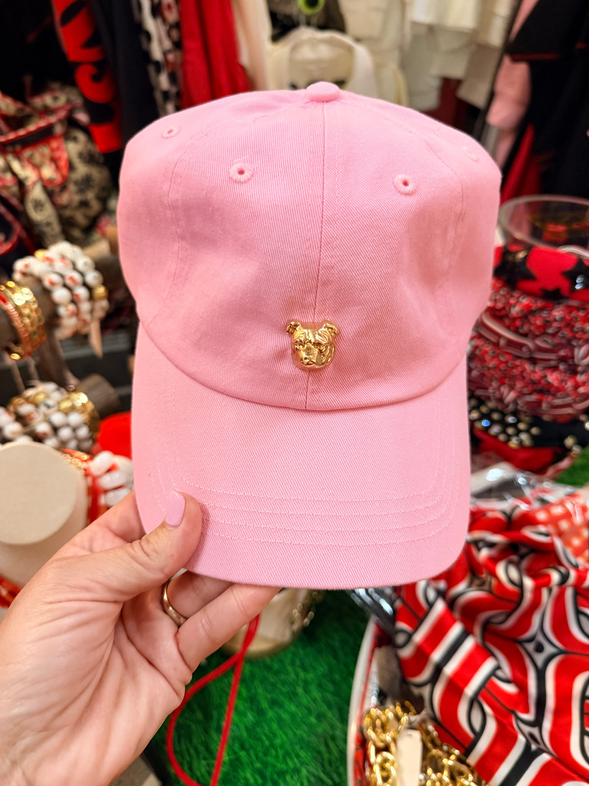 Pink hat with gold bulldog