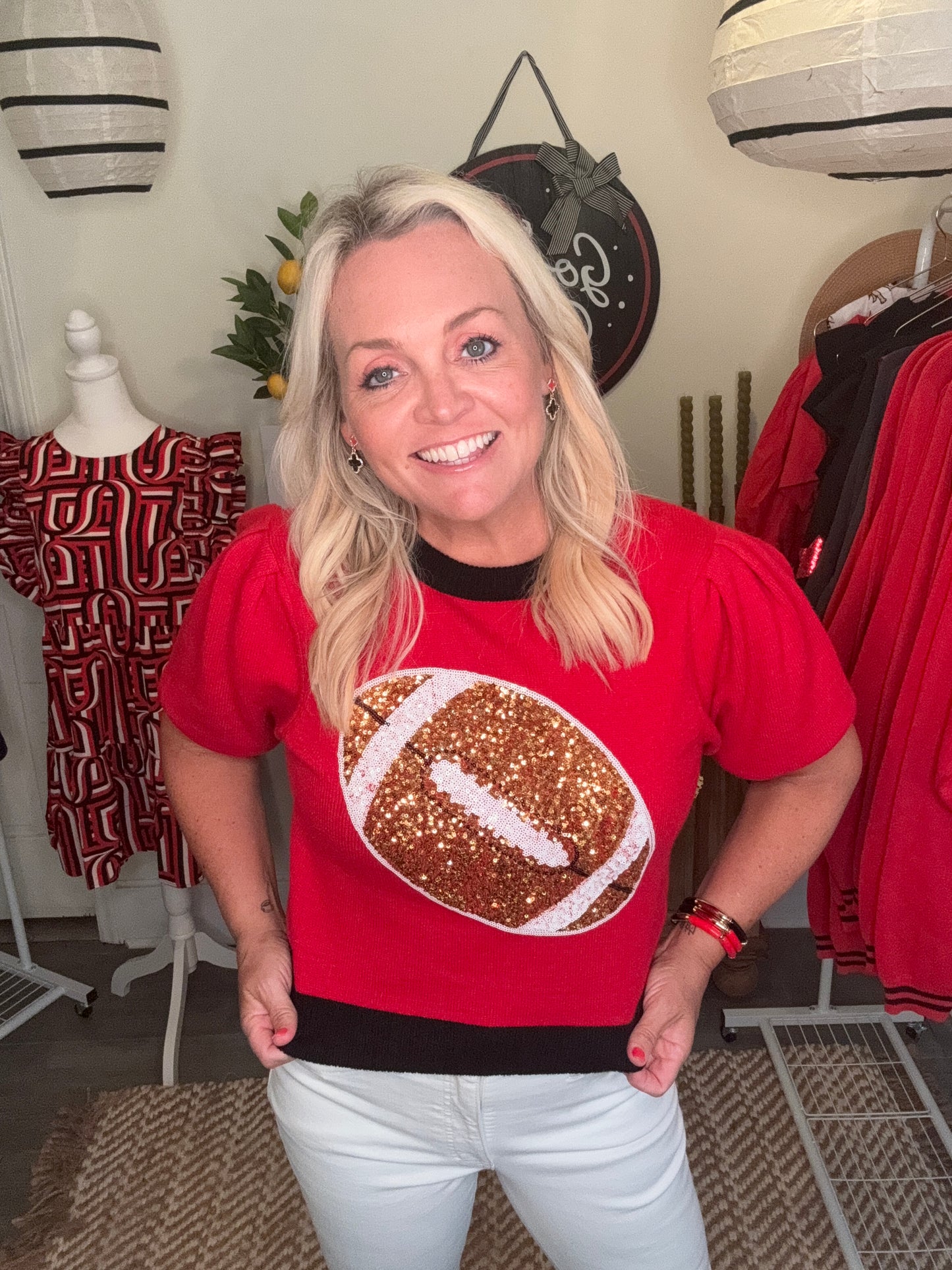 Red and black sweater sequin football