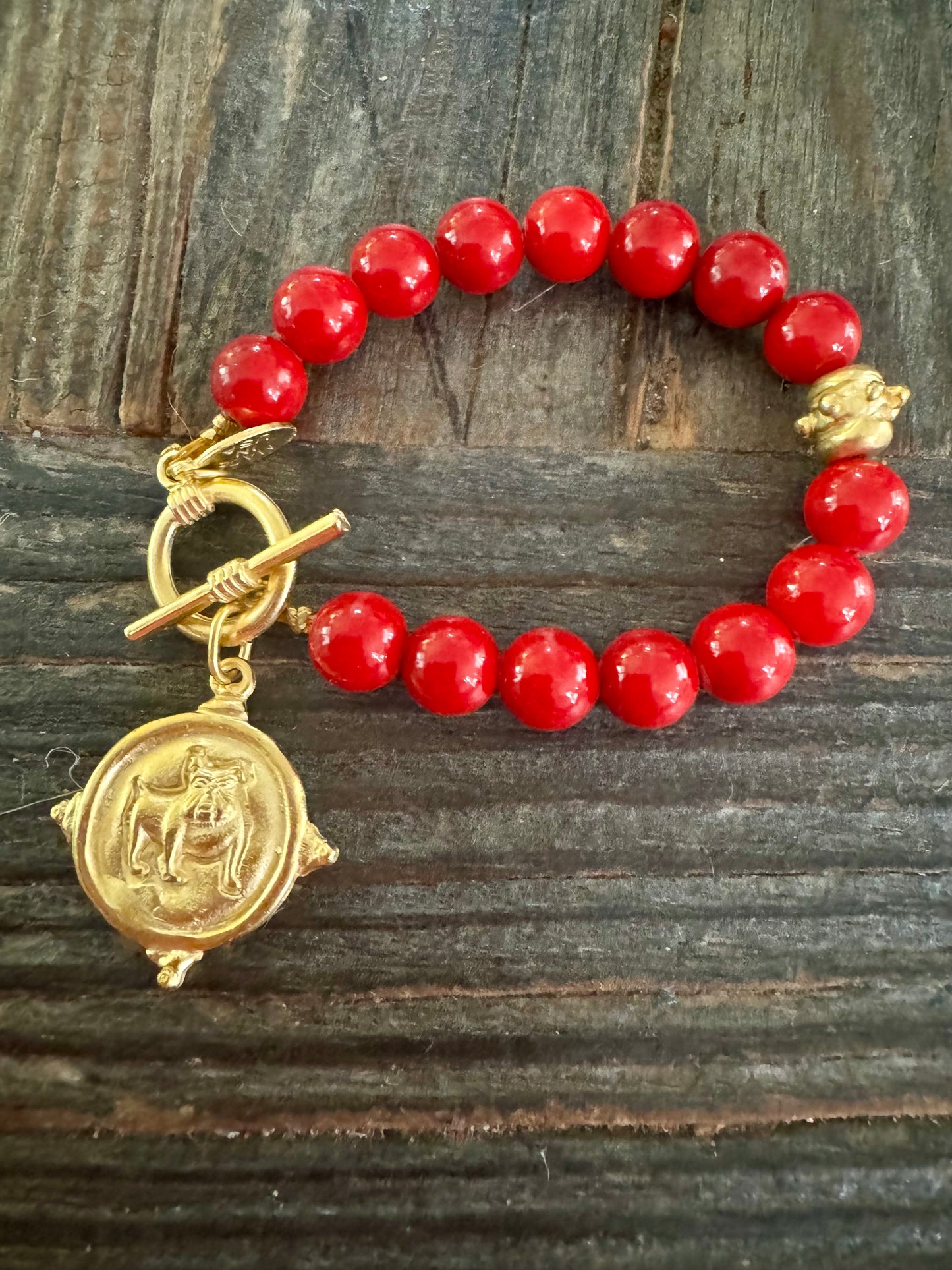 Gold dog medallion bracelet red coral Susan Shaw