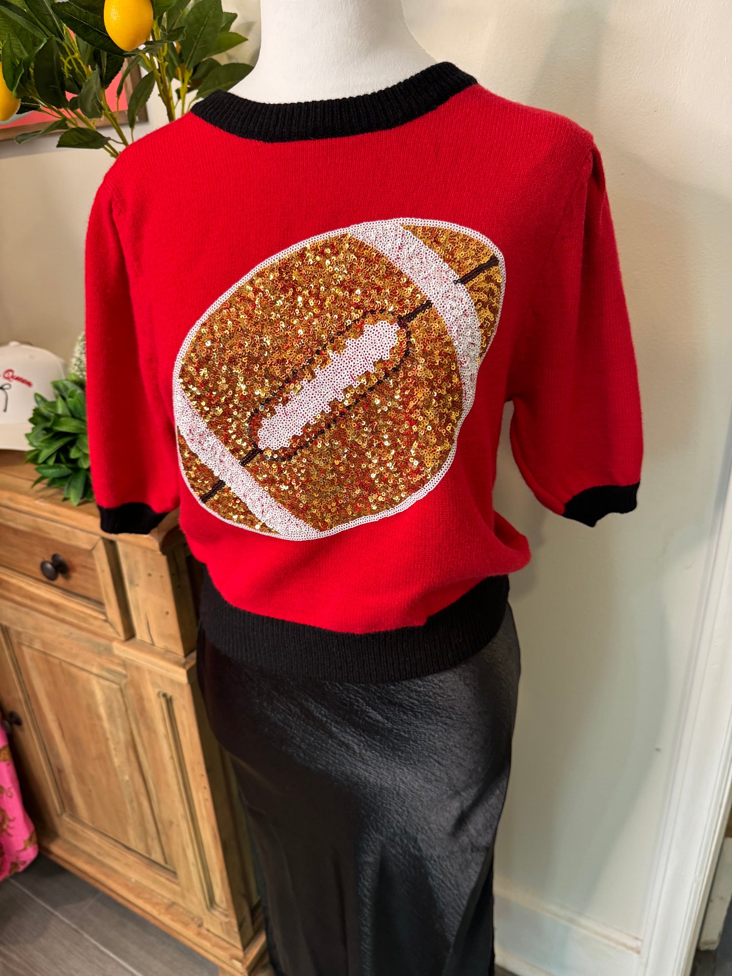 Red and black sweater sequin football