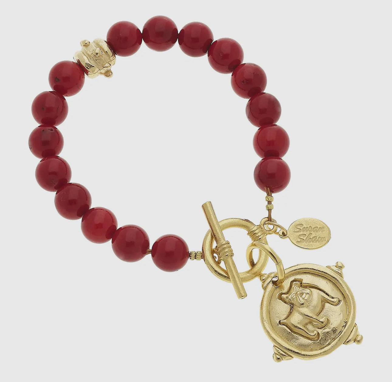 Gold dog medallion bracelet red coral Susan Shaw