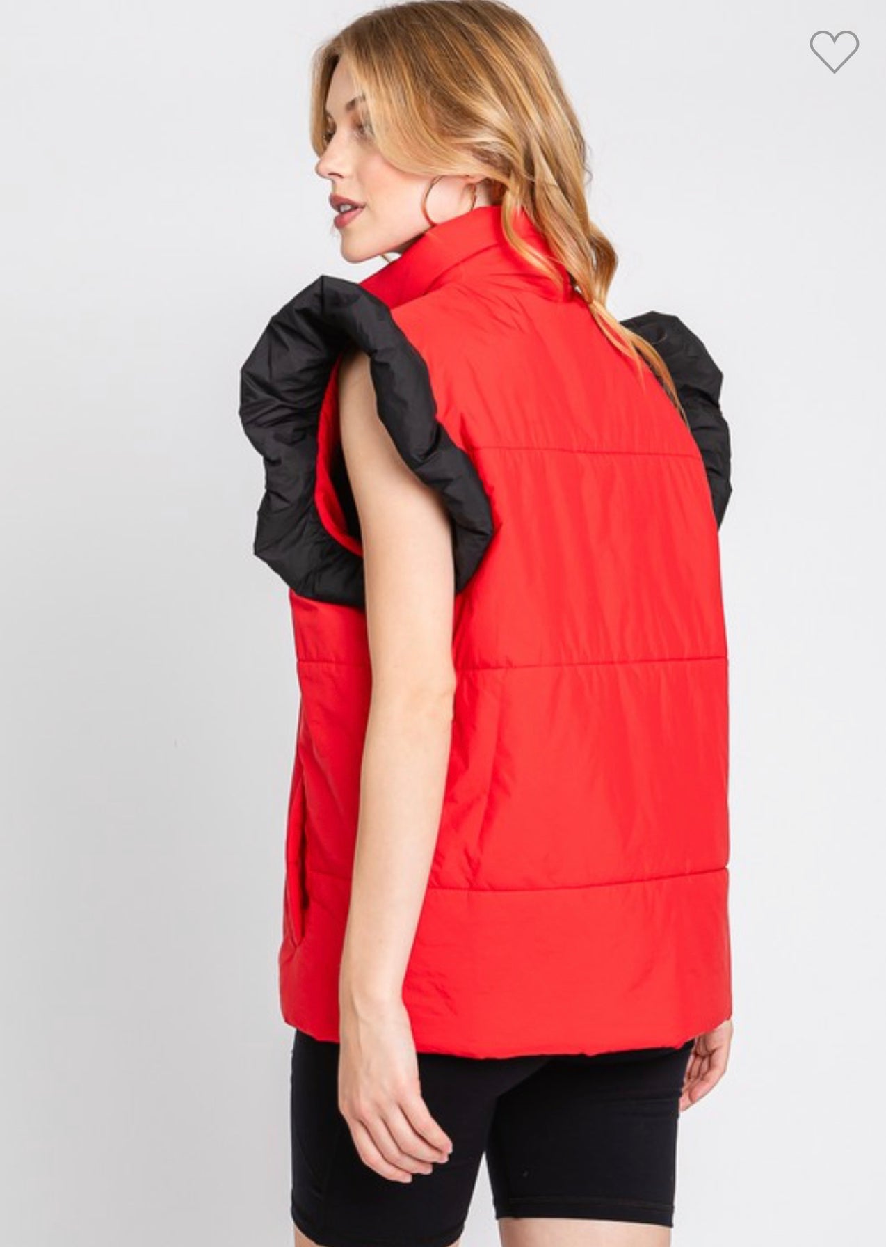 red puffer vest with black ruffle sleeves