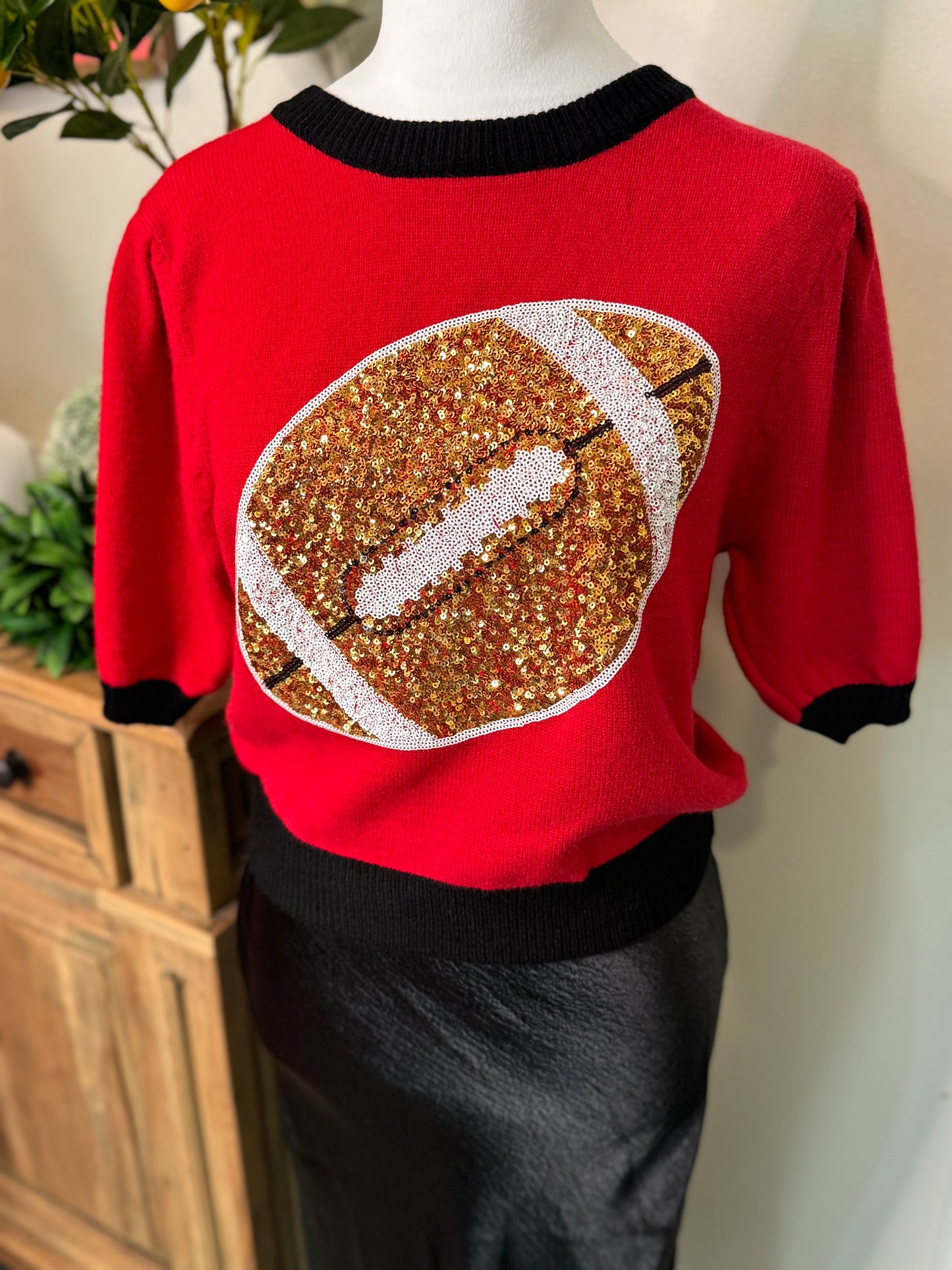 Red and black sweater sequin football