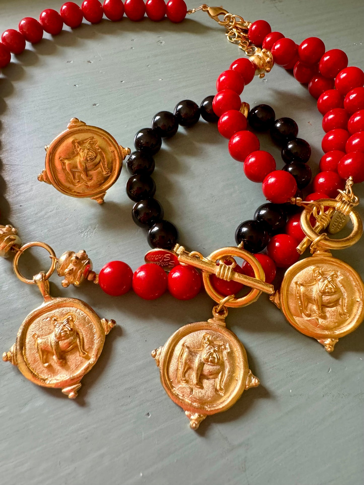 Gold dog medallion bracelet red coral Susan Shaw