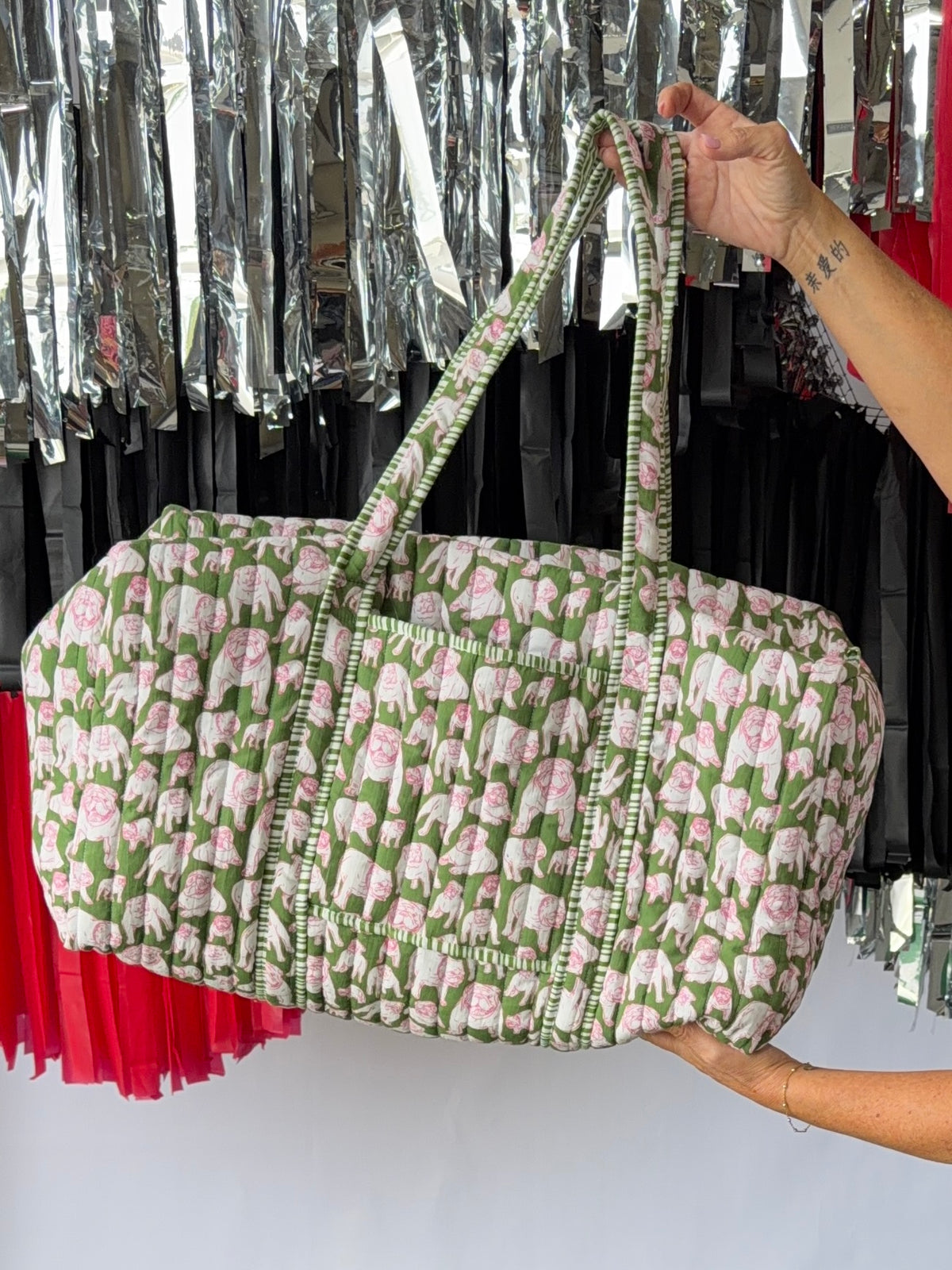 Green and pink quilted bulldog duffle