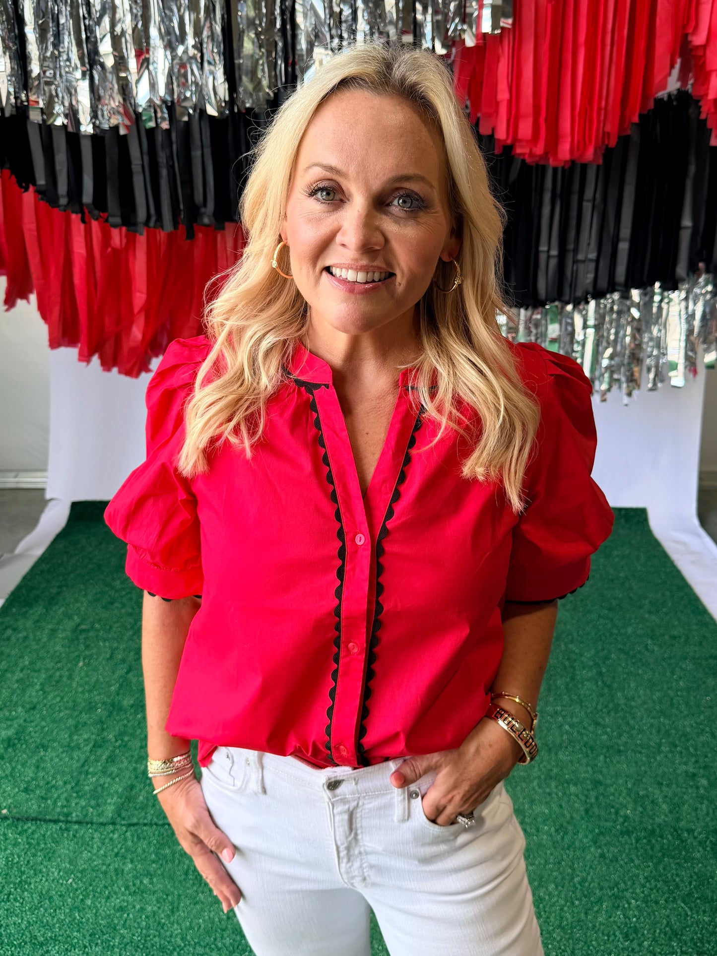 Red blouse with black pipping